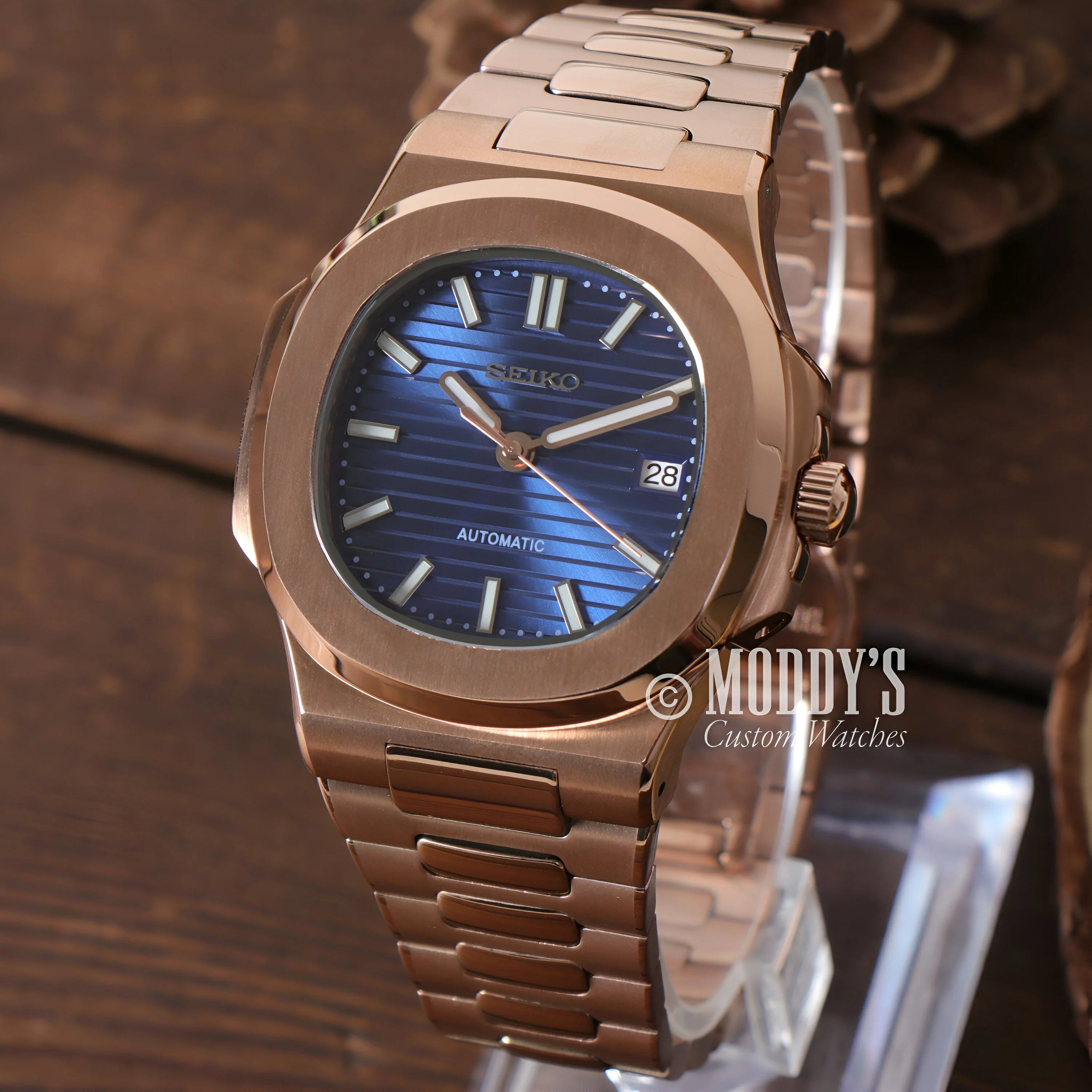 Rose gold Patek Philippe Nautilus watch with blue dial in Nautiko Rose Gold collection