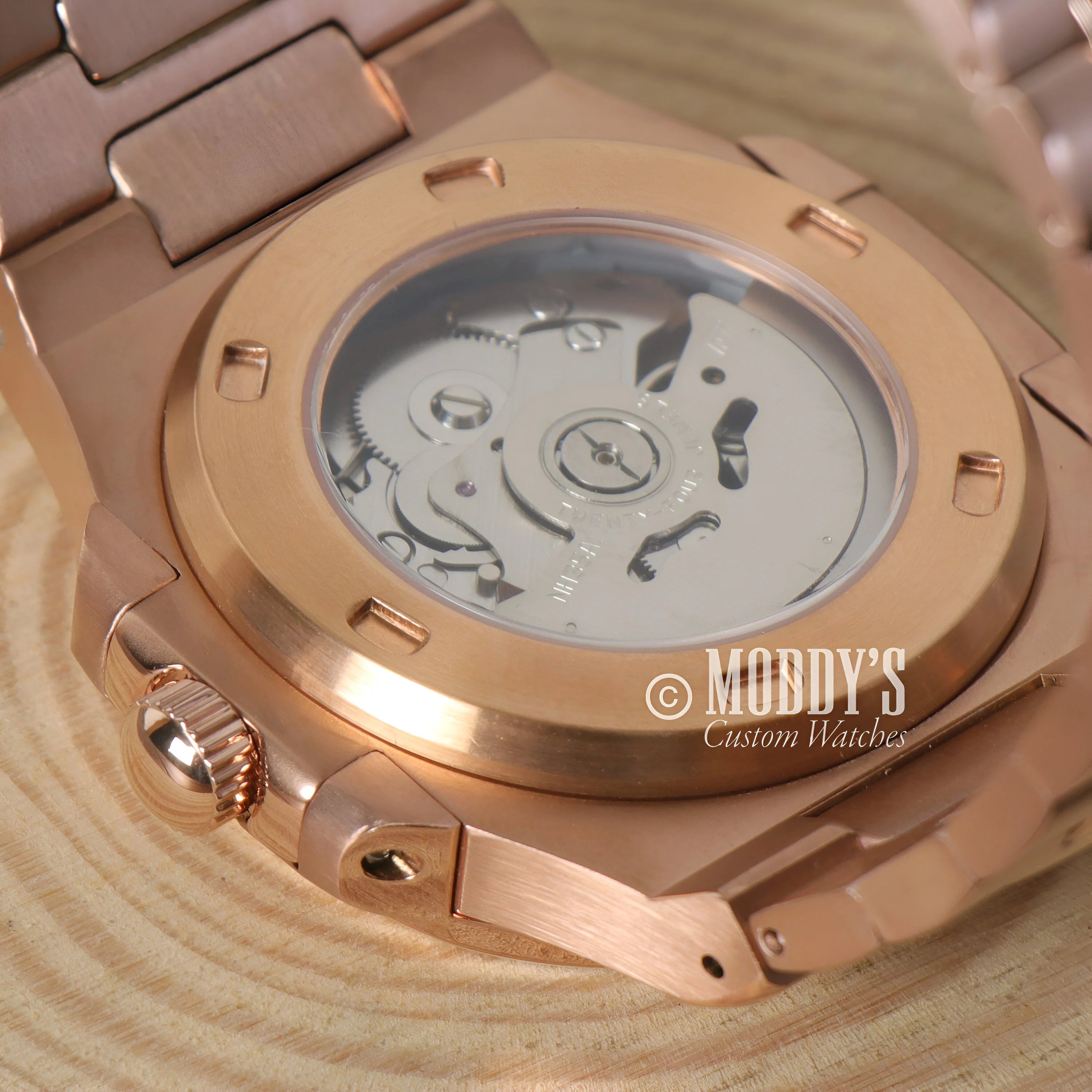 Rose gold watch movement visible in Nautiko Rose Gold Royal Blue Seiko mod rose