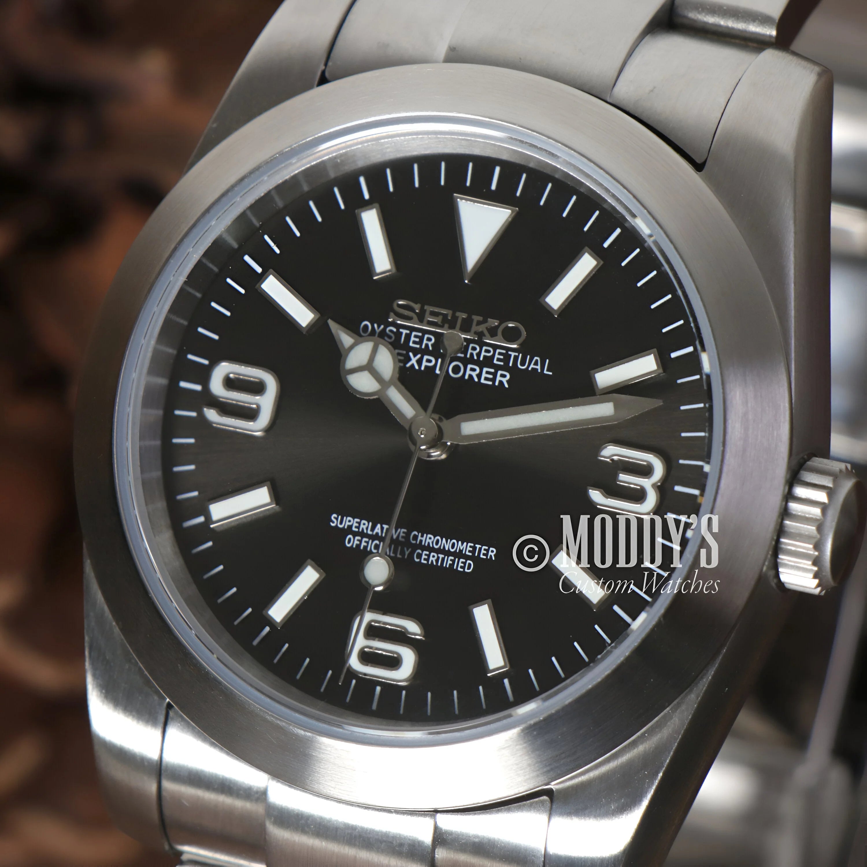 Stainless steel Oysteiko Black Explorer watch features black dial and Arabic numerals