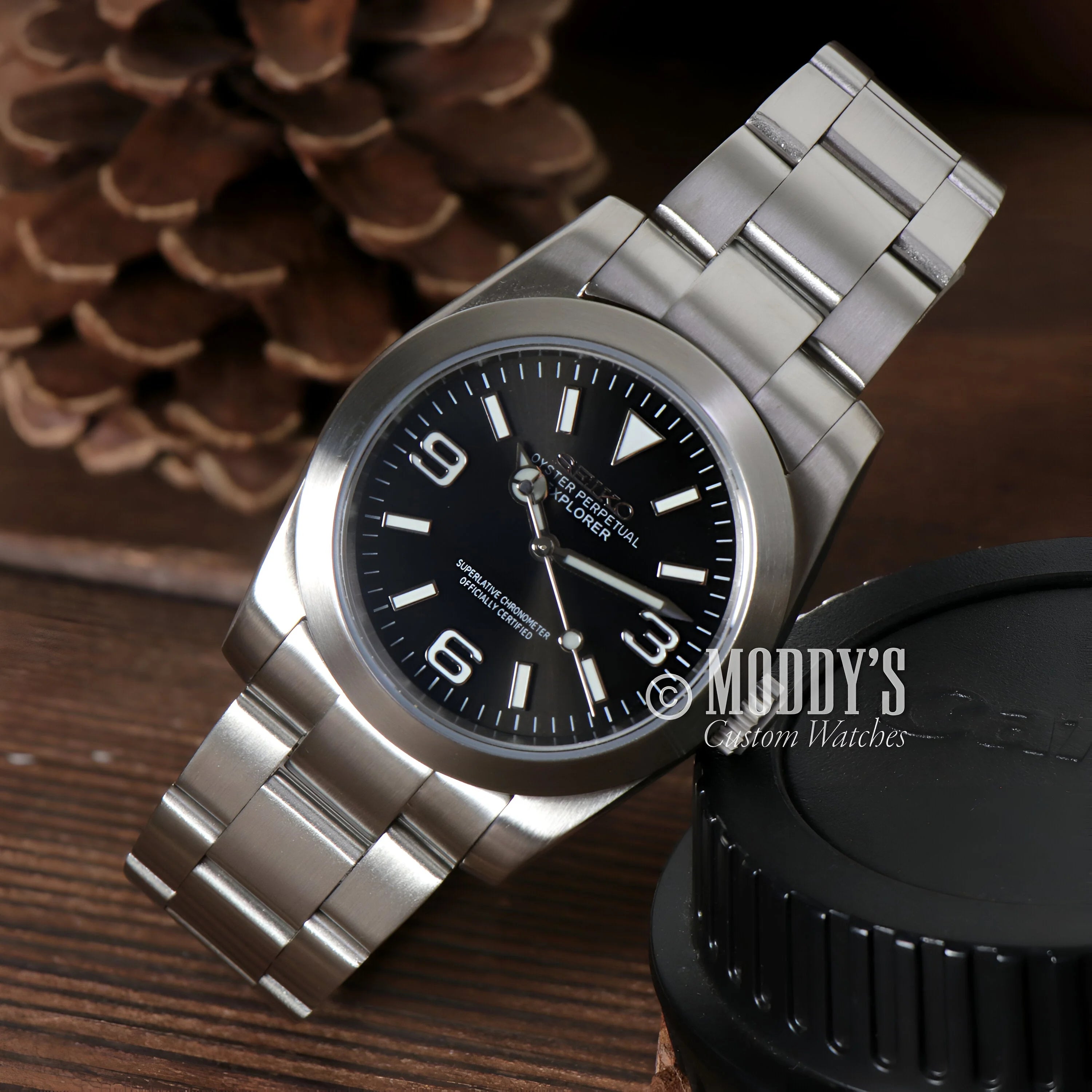 Stainless steel Rolex Explorer watch with black dial, part of the Seiko Mod Oyster collection