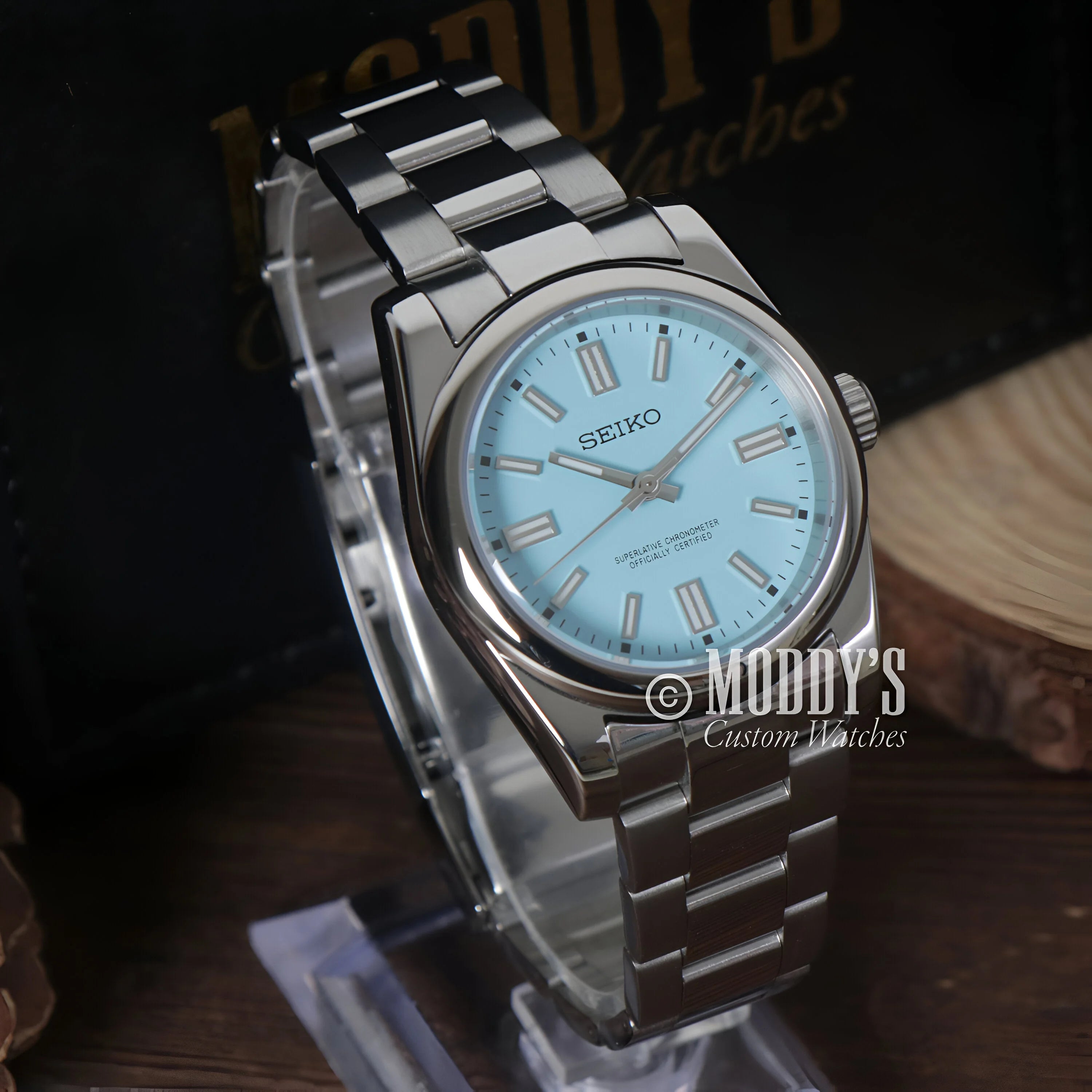 Seiko wristwatch with light blue dial and stainless steel bracelet in Seiko Mod Oyster style