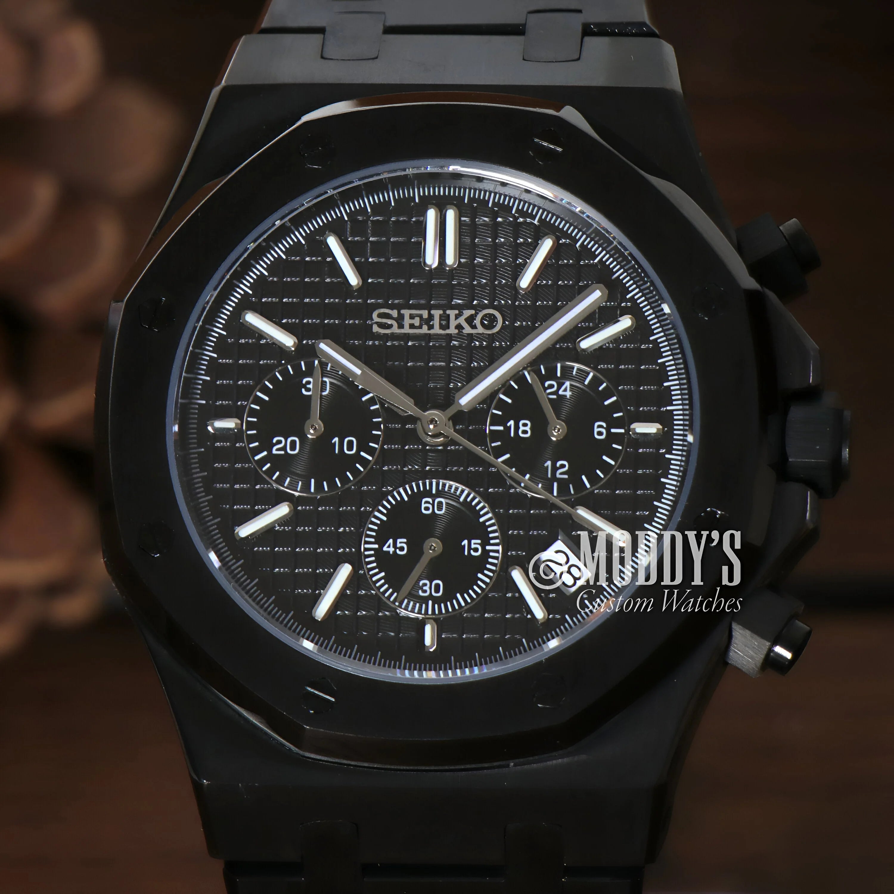 Black Seiko Chronograph wristwatch showcasing Royal Seikoak Chrono Triple Black design