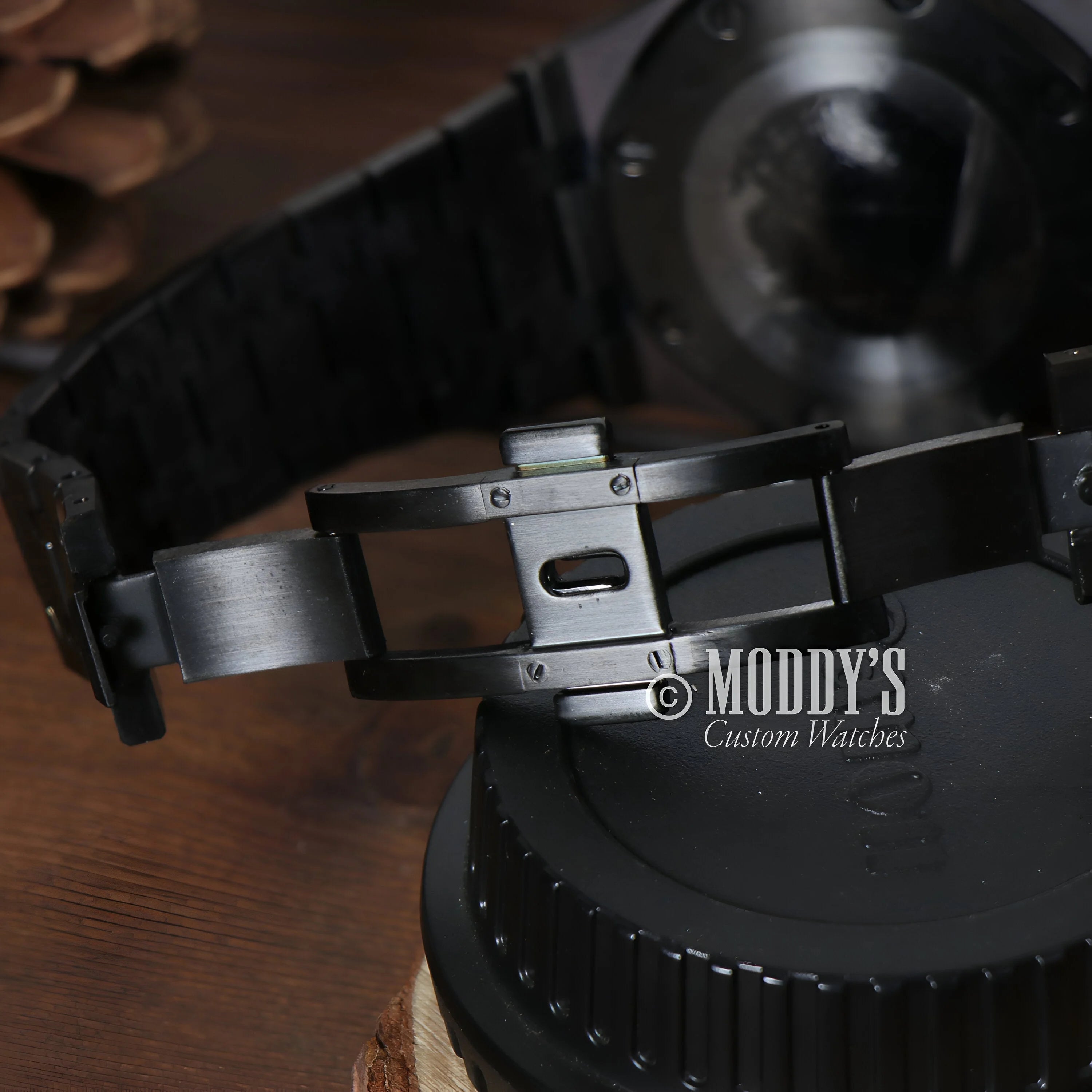 Metal watch clasp engraved with MODDY’S Custom Watches on Royal Seikoak Chrono Triple Black