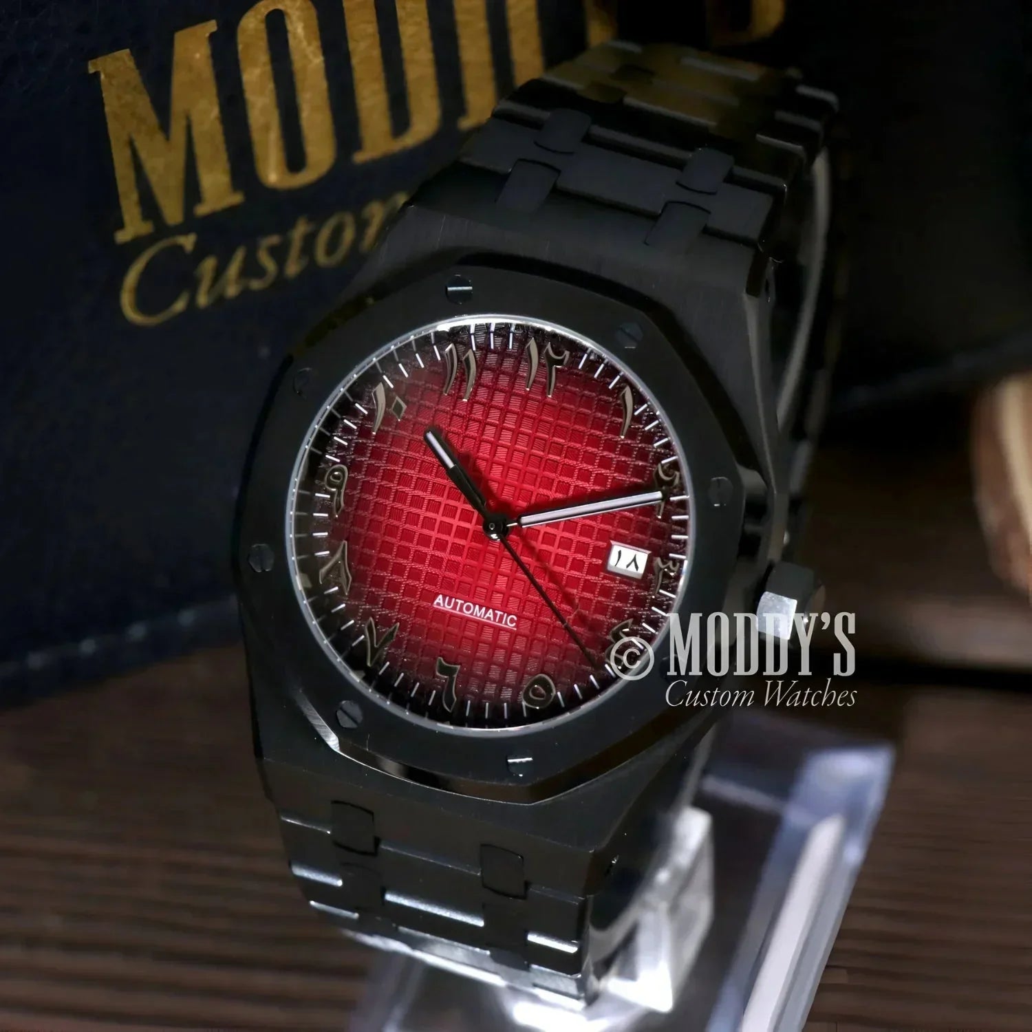 Black wristwatch with red face from Royal Seikoak featuring NH35 automatic movement