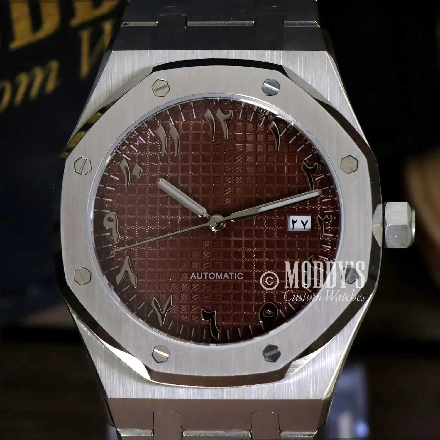 Silver wristwatch with brown Arabic numeral dial, Royal Seikoak, NH35 automatic movement
