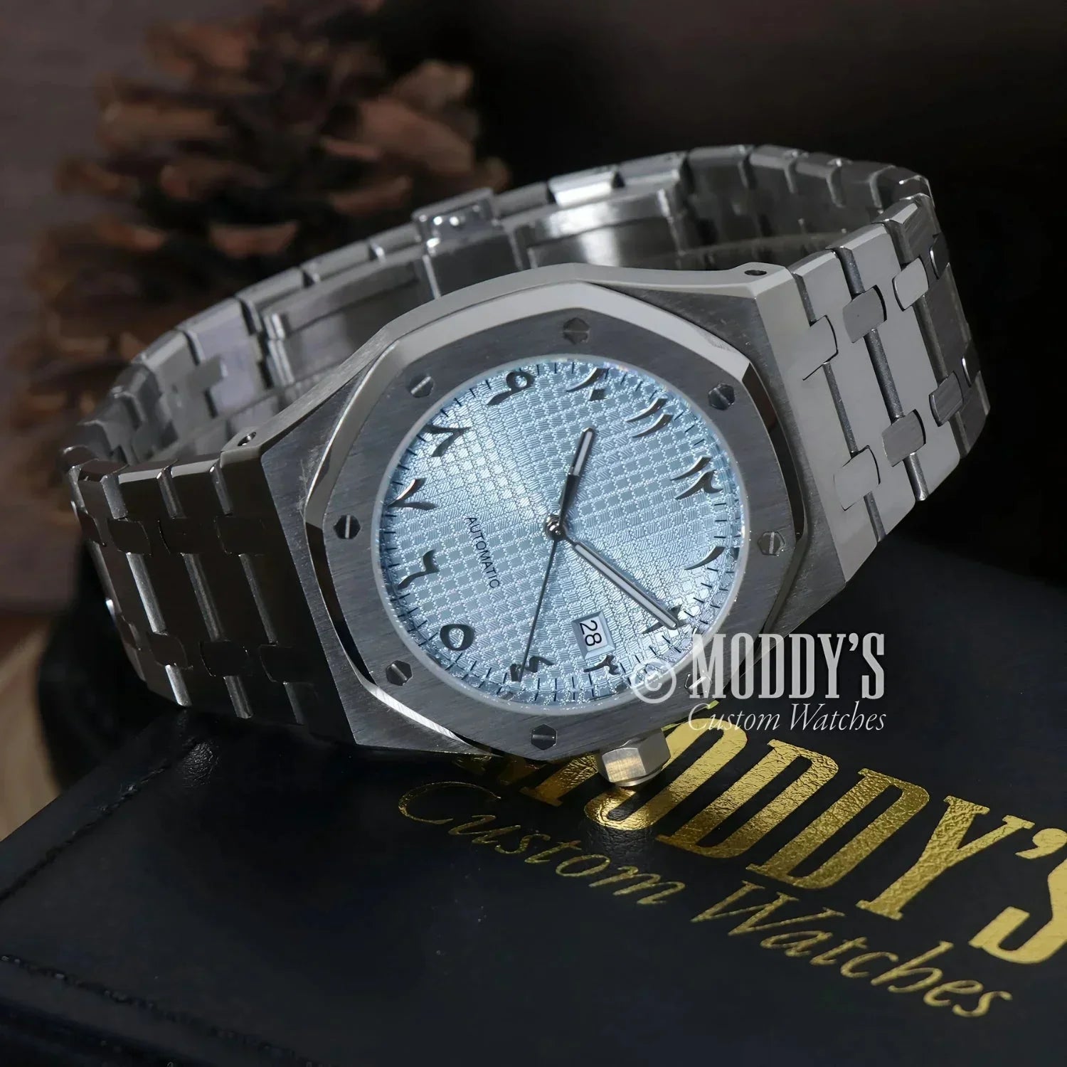 Silver Royal Seikoak wristwatch with Arabic numerals and NH35 automatic movement