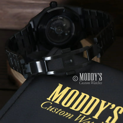 Black wristwatch with metal band from Royal Seikoak featuring Seiko NH72 automatic movement