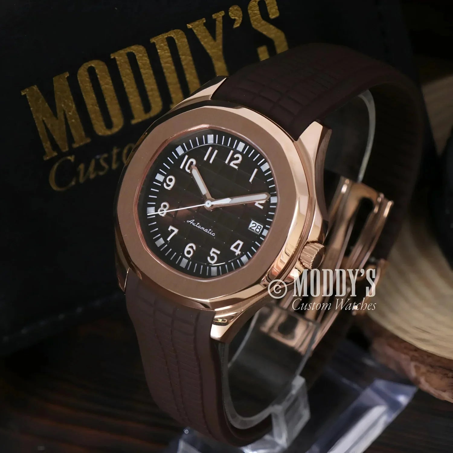 Rose gold wristwatch with brown band showcasing Seiko Mod Aquanaut design