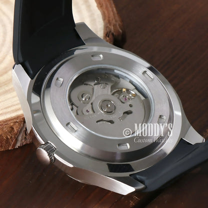 Silver watch Seikonaut with NH35 automatic movement showcasing visible mechanics