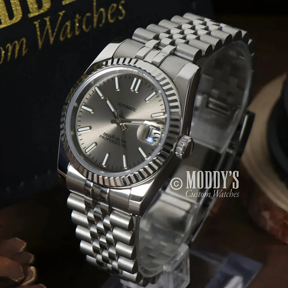 Silver wristwatch with fluted bezel from Seikojust Champagne, featuring Seiko NH35 automatic
