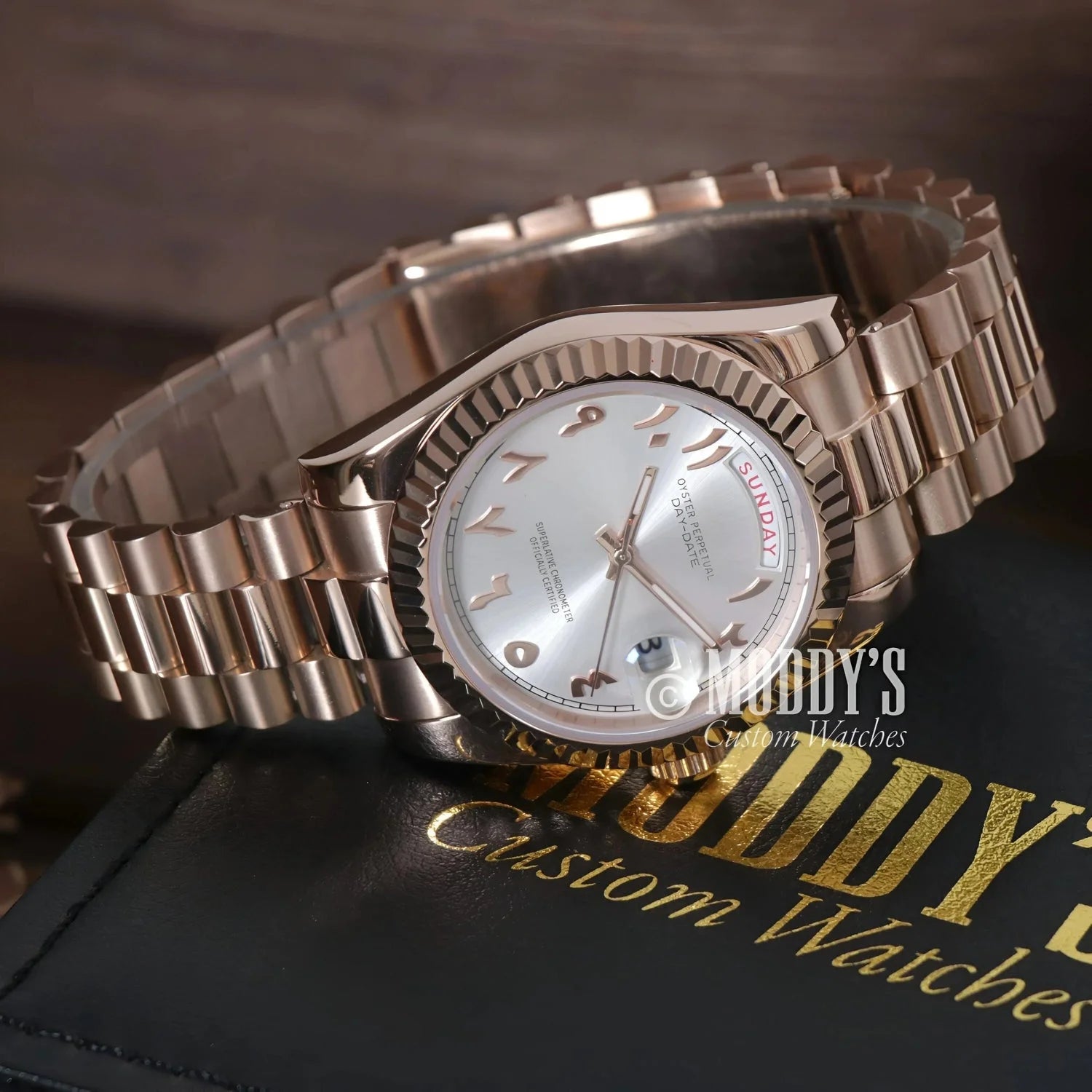 Rose gold wristwatch with Arabic numerals from Seikojust Daydate Rose Gold collection