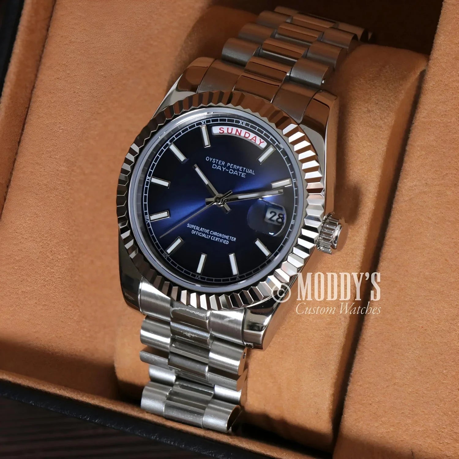 Silver wristwatch with blue face, Seiko Mod Daydate Royal Blue in 904L stainless steel