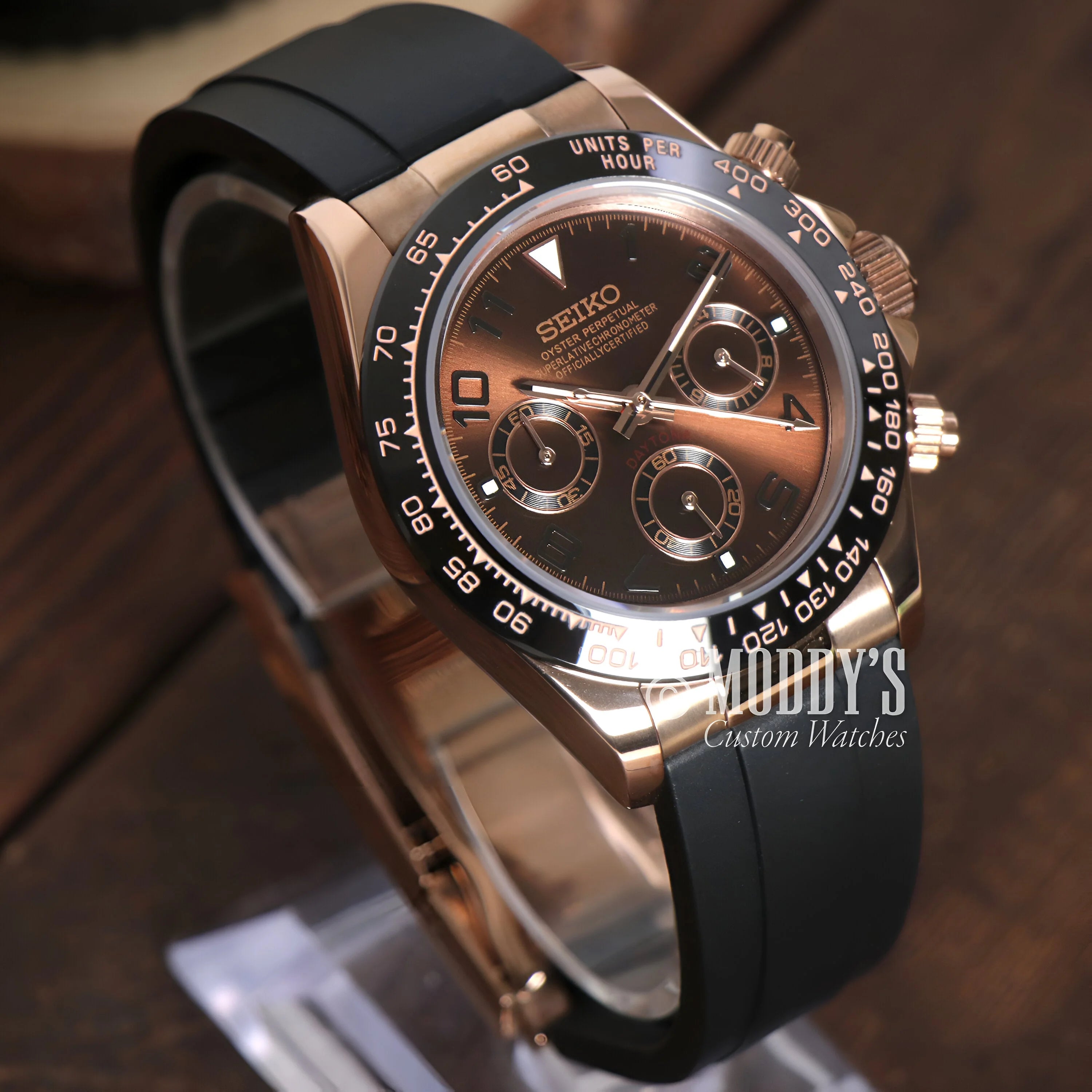 Elegant Seiko wristwatch with black dial, rose gold case, and rubber strap in Seitona Chocolate