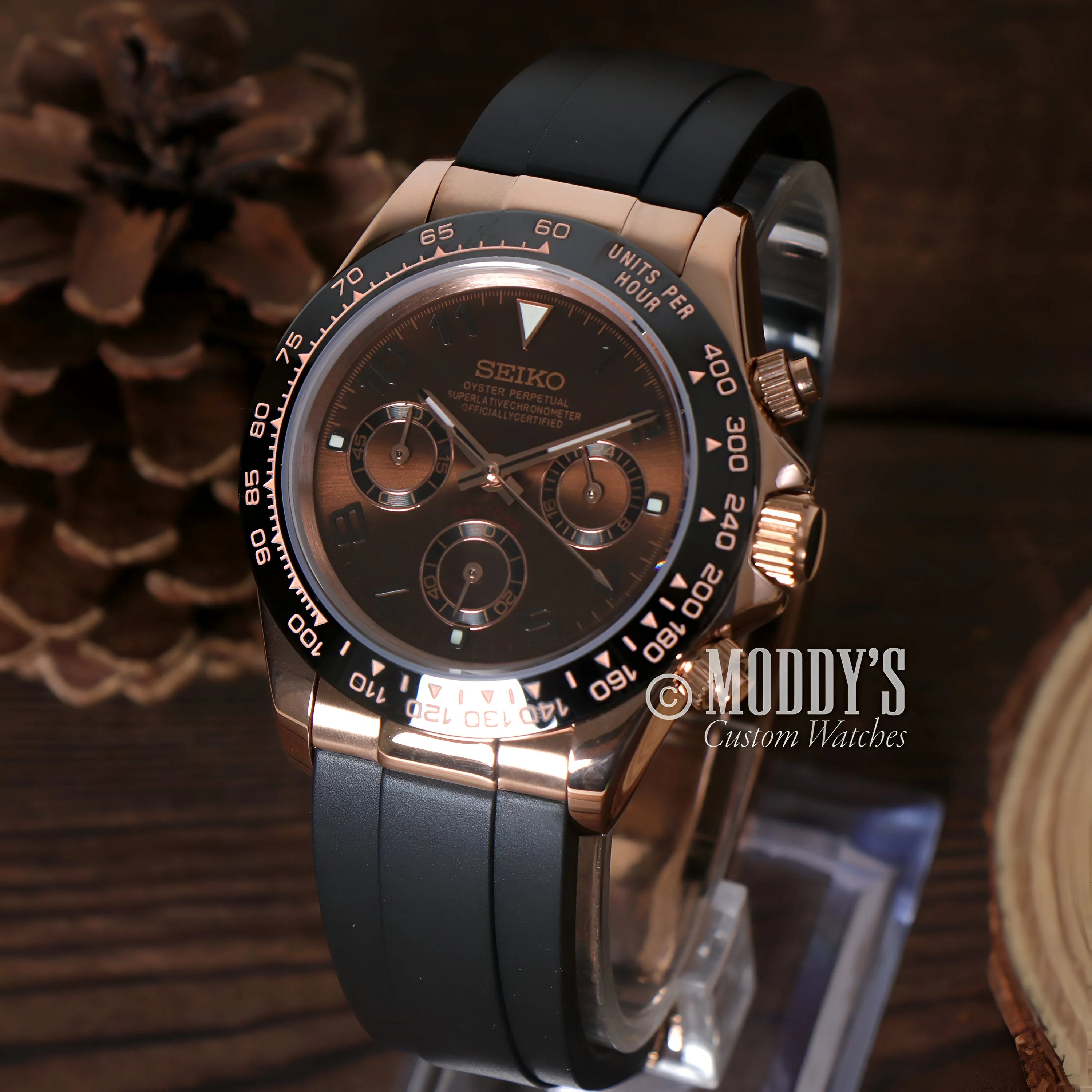 Elegant Seiko wristwatch with rose gold case and black dial, inspired by Seiko Mod Daytona