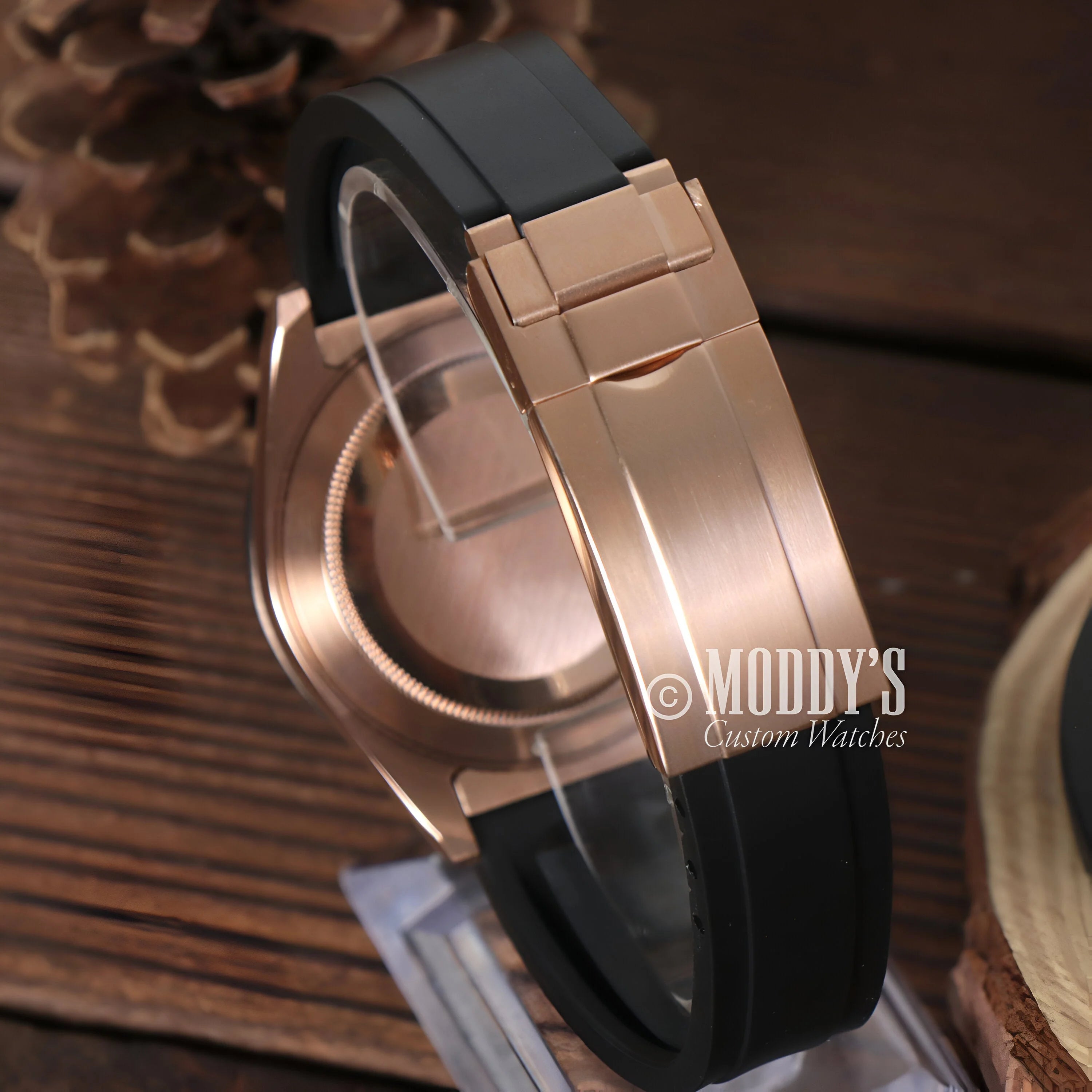 Luxury wristwatch featuring rose gold case and black rubber strap, Seiko Mod Daytona