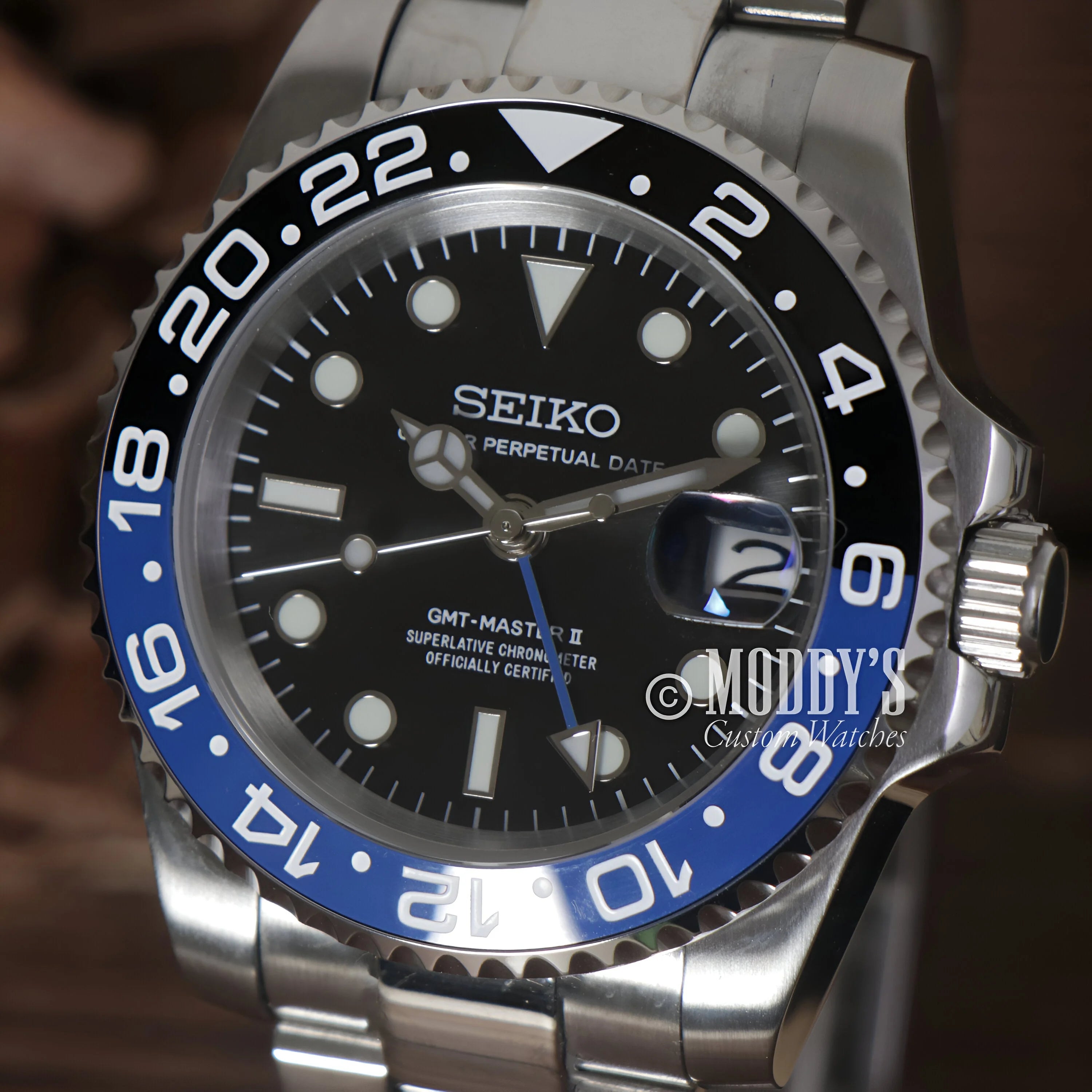 Seiko GMT dive watch with black dial and blue-black Batman bezel in GMTeiko case