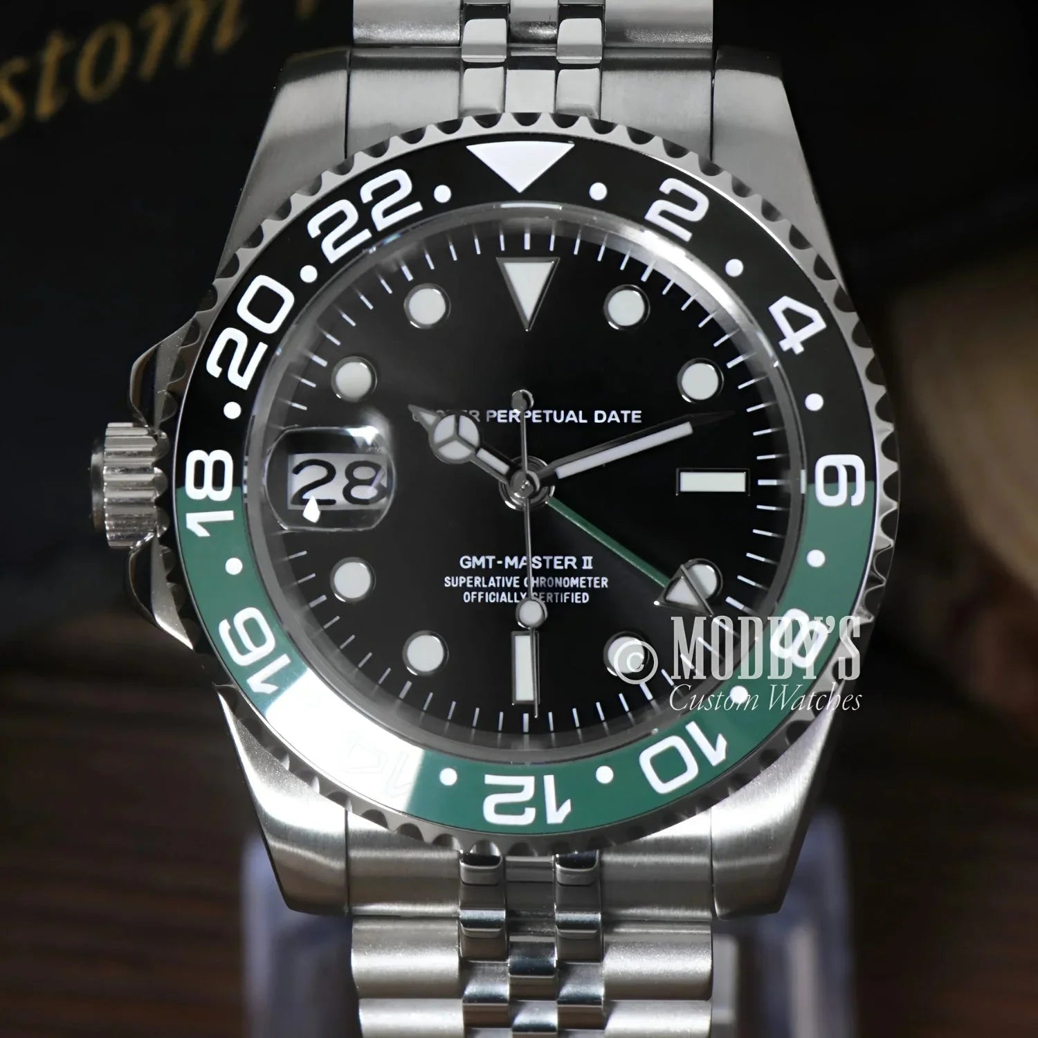 Green and black Rolex GMT-Master II watch featuring Seiko NH34 automatic movement