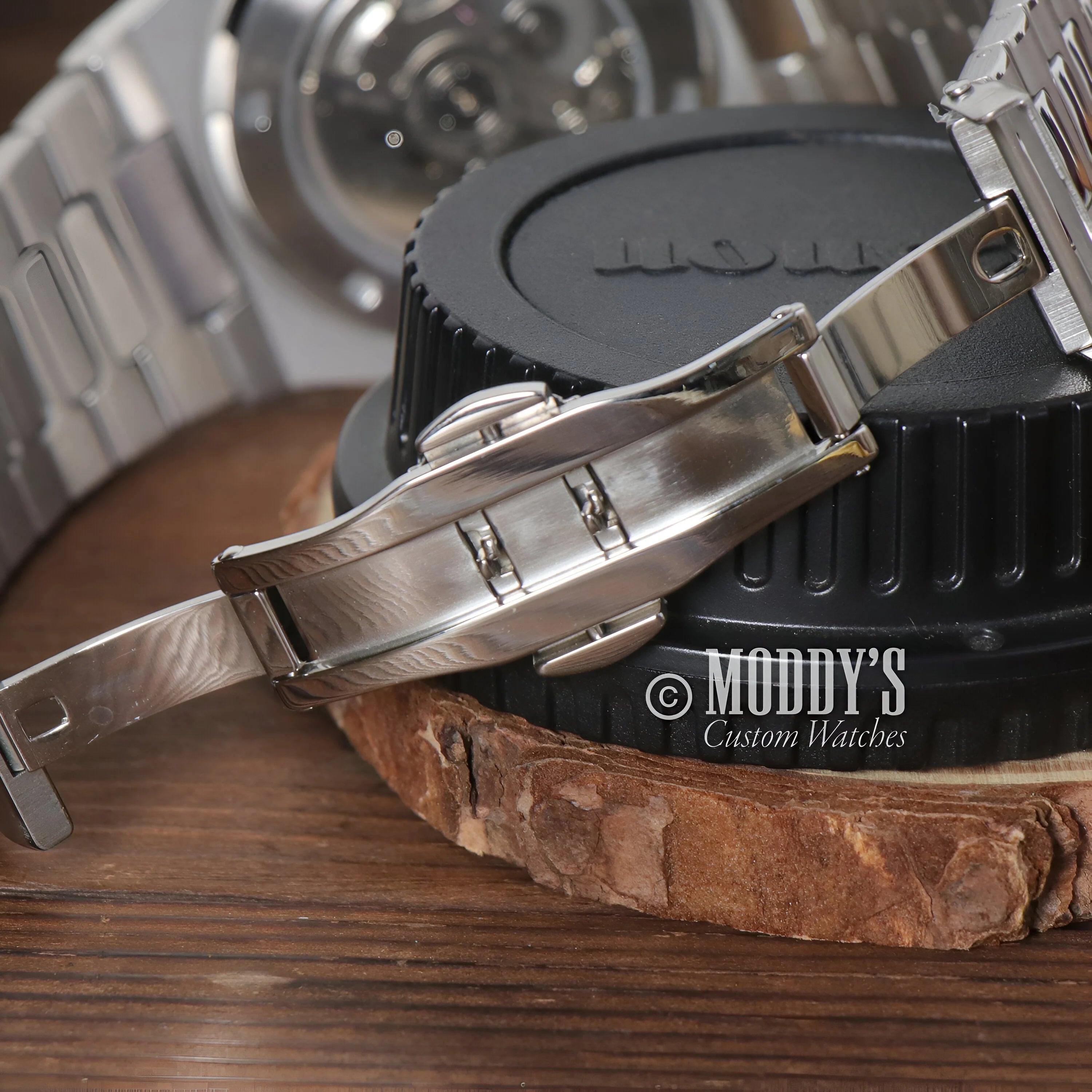 Luxury Seiko Mod Nautilus Wristwatch With Metal Bracelet On Wooden Surface