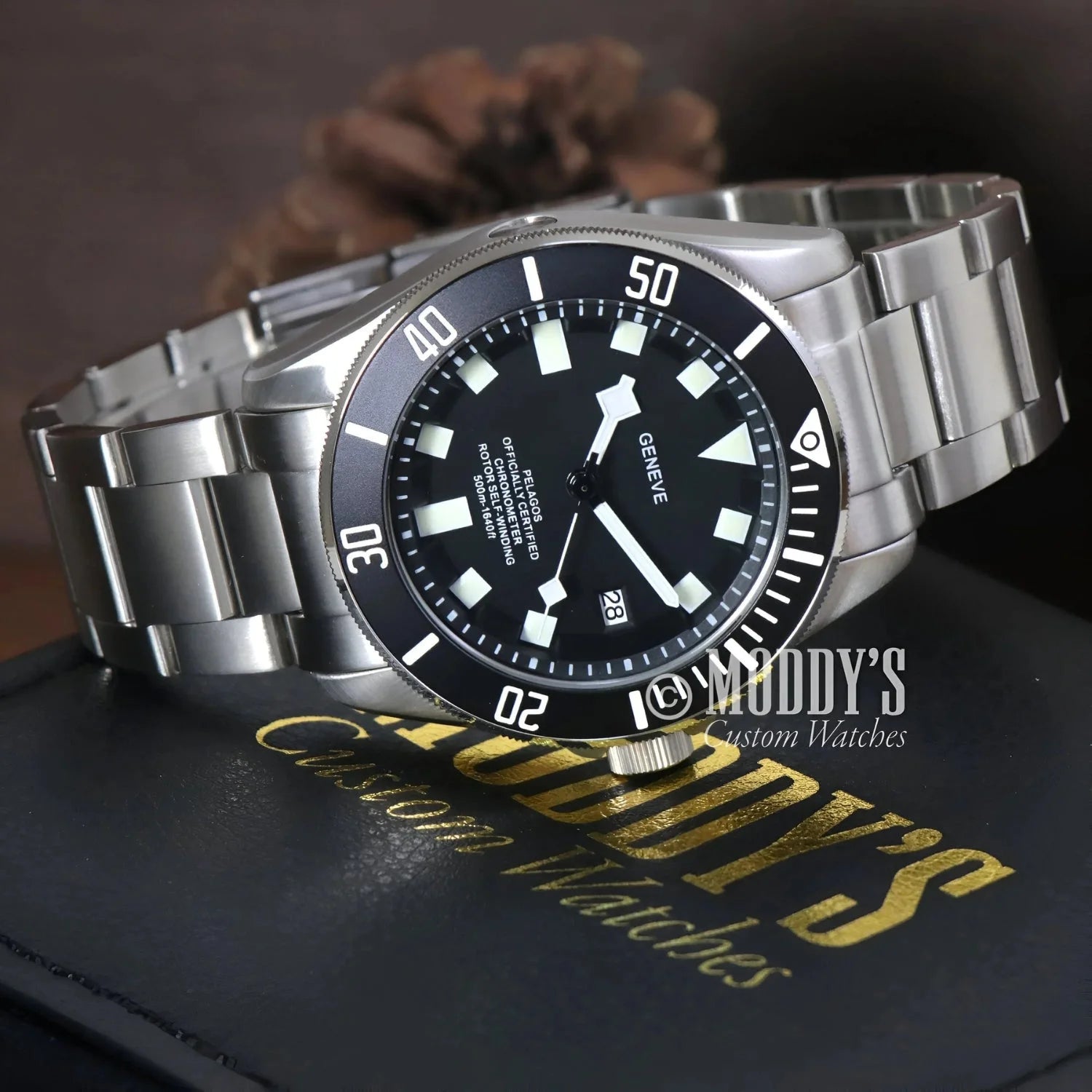 Silver wristwatch with black dial, Tudeiko Pelagos Black featuring Seiko NH35 automatic