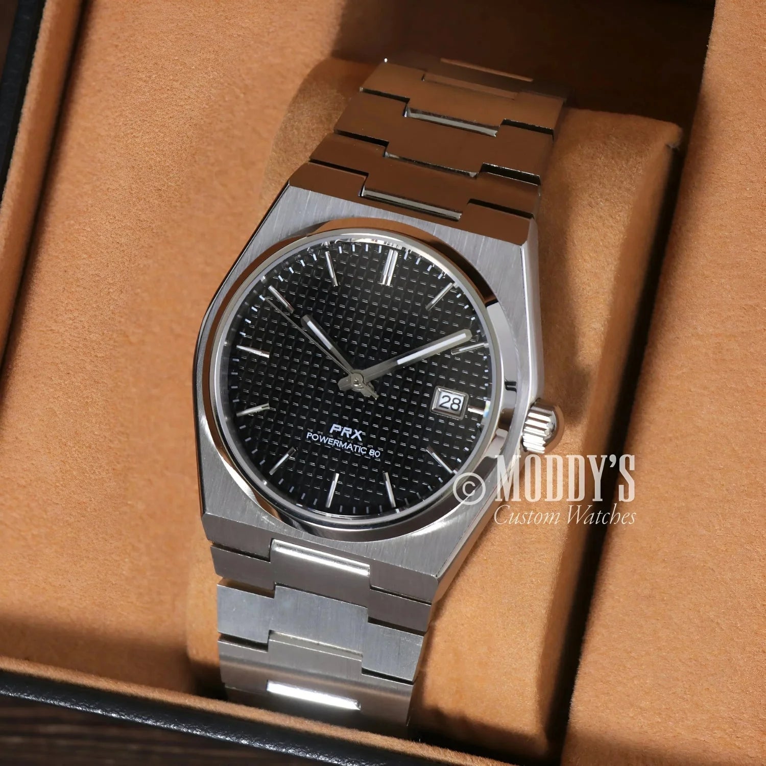 Silver Tissot PRX Powermatic 80 watch in PRXeiko showcasing NH35 automatic movement