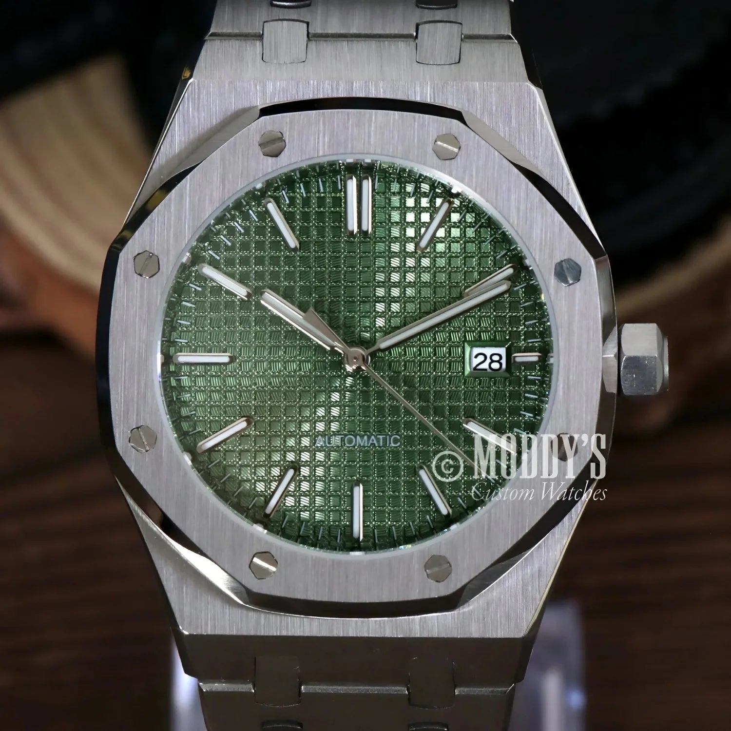 Silver wristwatch with green checkered face from Royal Seikoak, a stunning Seiko mod royal
