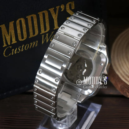 Silver metal watch with visible gears featuring NH35 automatic movement, Arabic White style