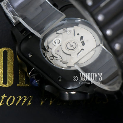 Black wristwatch with exposed NH35 automatic movement, Santeiko Black Ghost Arabic model