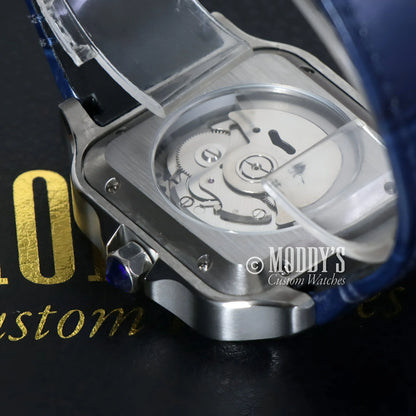 Silver wristwatch with visible gears in Santeiko White Blue Leather, featuring Seiko NH35 automatic