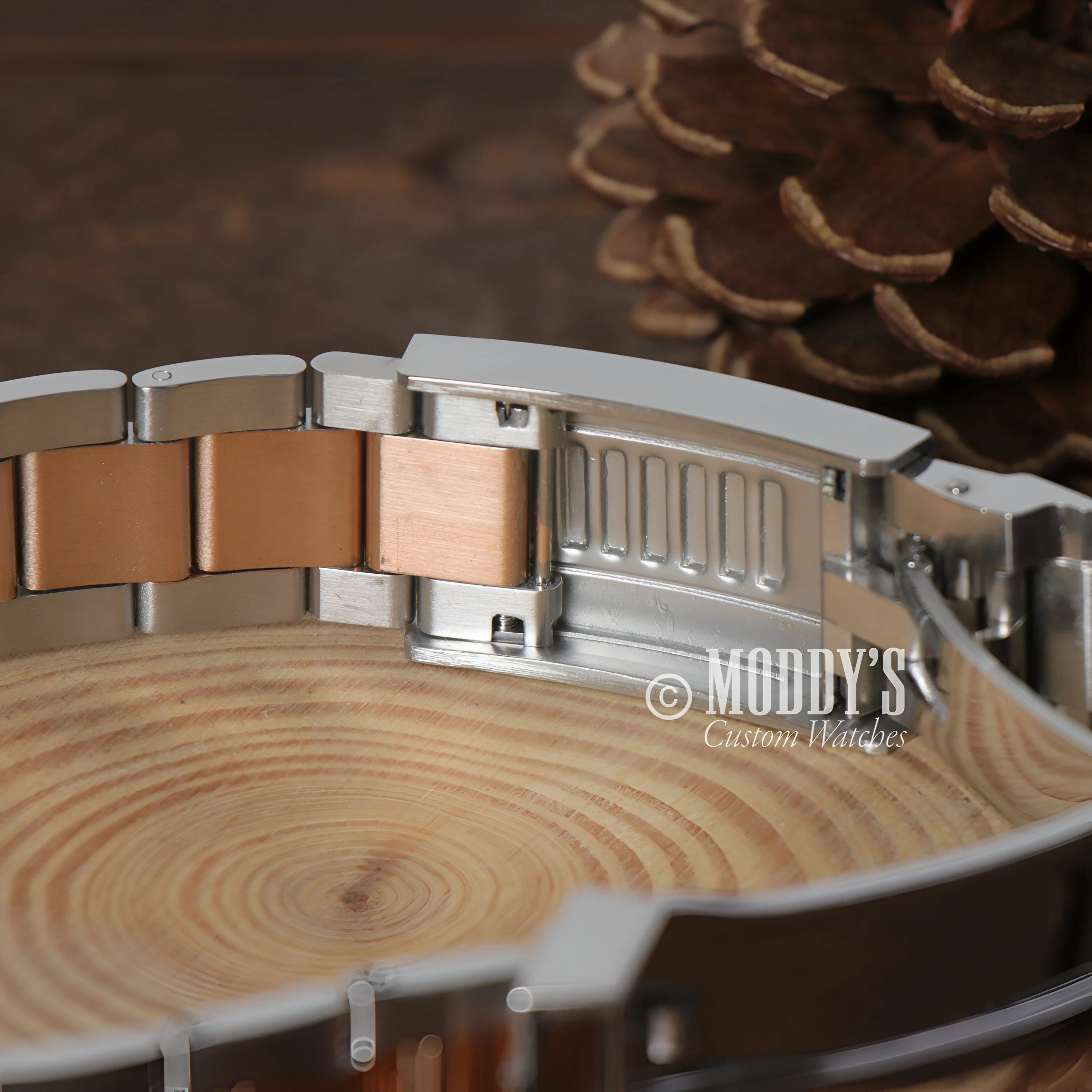 Seikomarine Rose Gold Two-tone Metal Watch Bracelet With Silver And Rose Gold Links On Wood