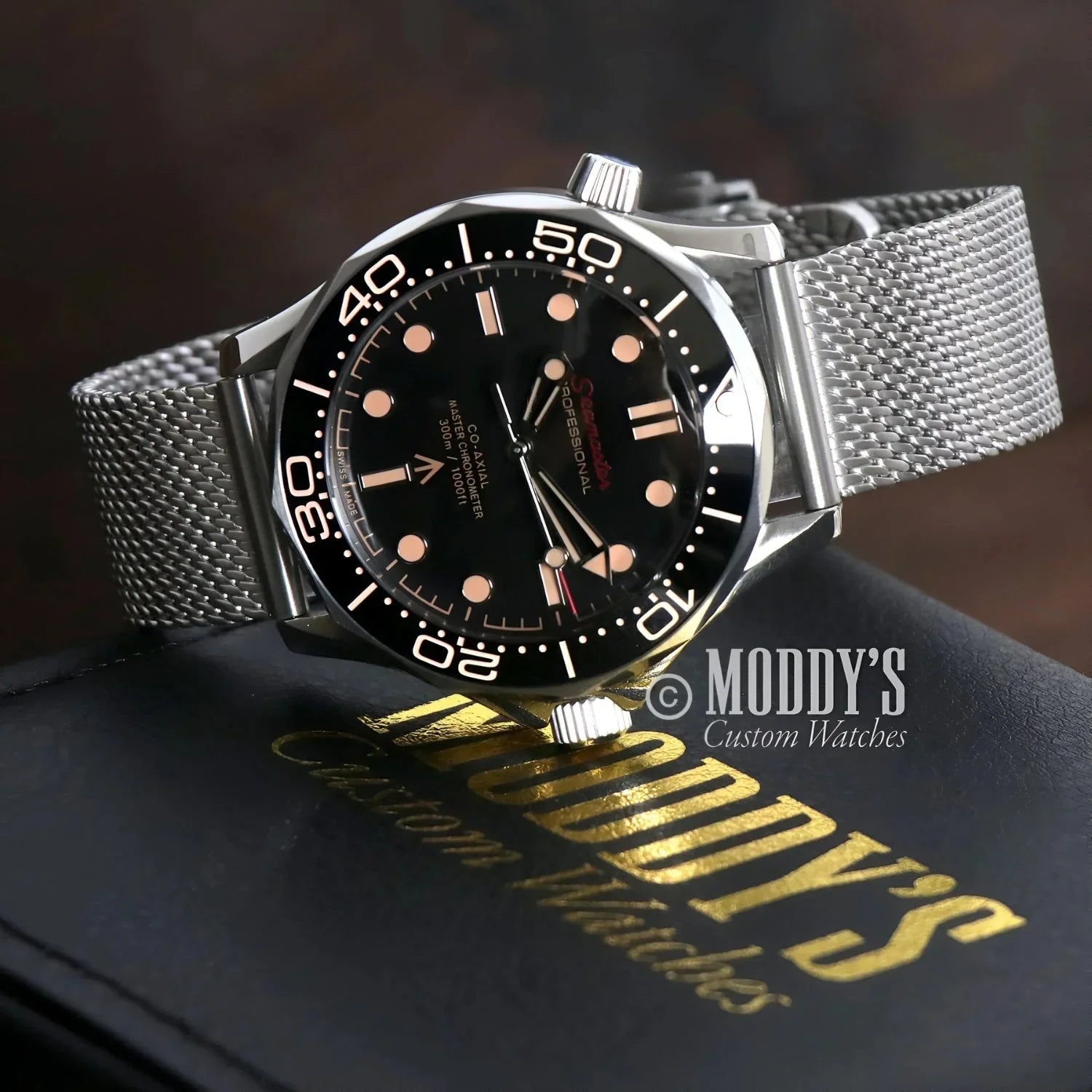 Silver Seikomaster wristwatch with black face featuring NH35 automatic movement