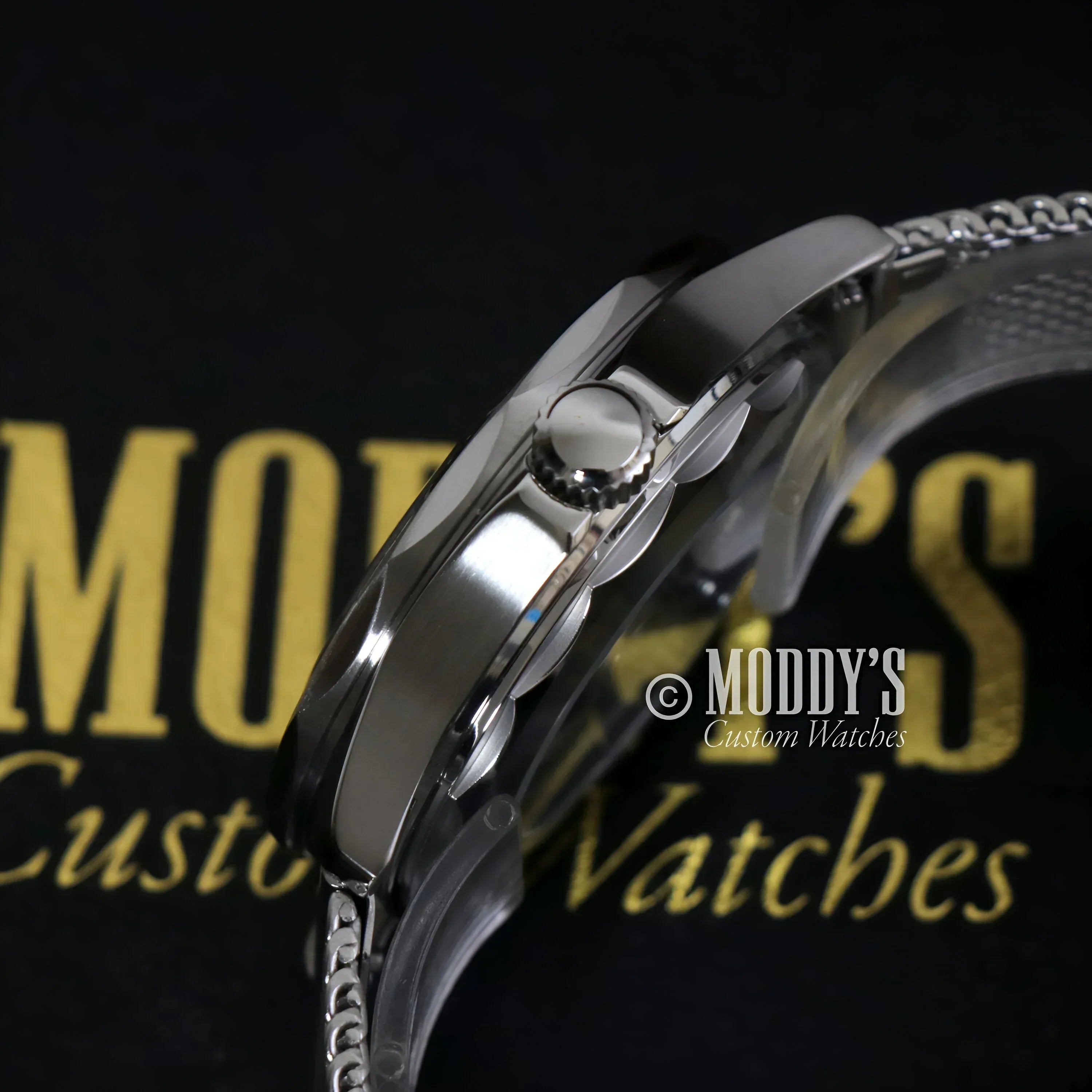 Silver Seikomaster wristwatch with mesh band featuring NH35 automatic movement