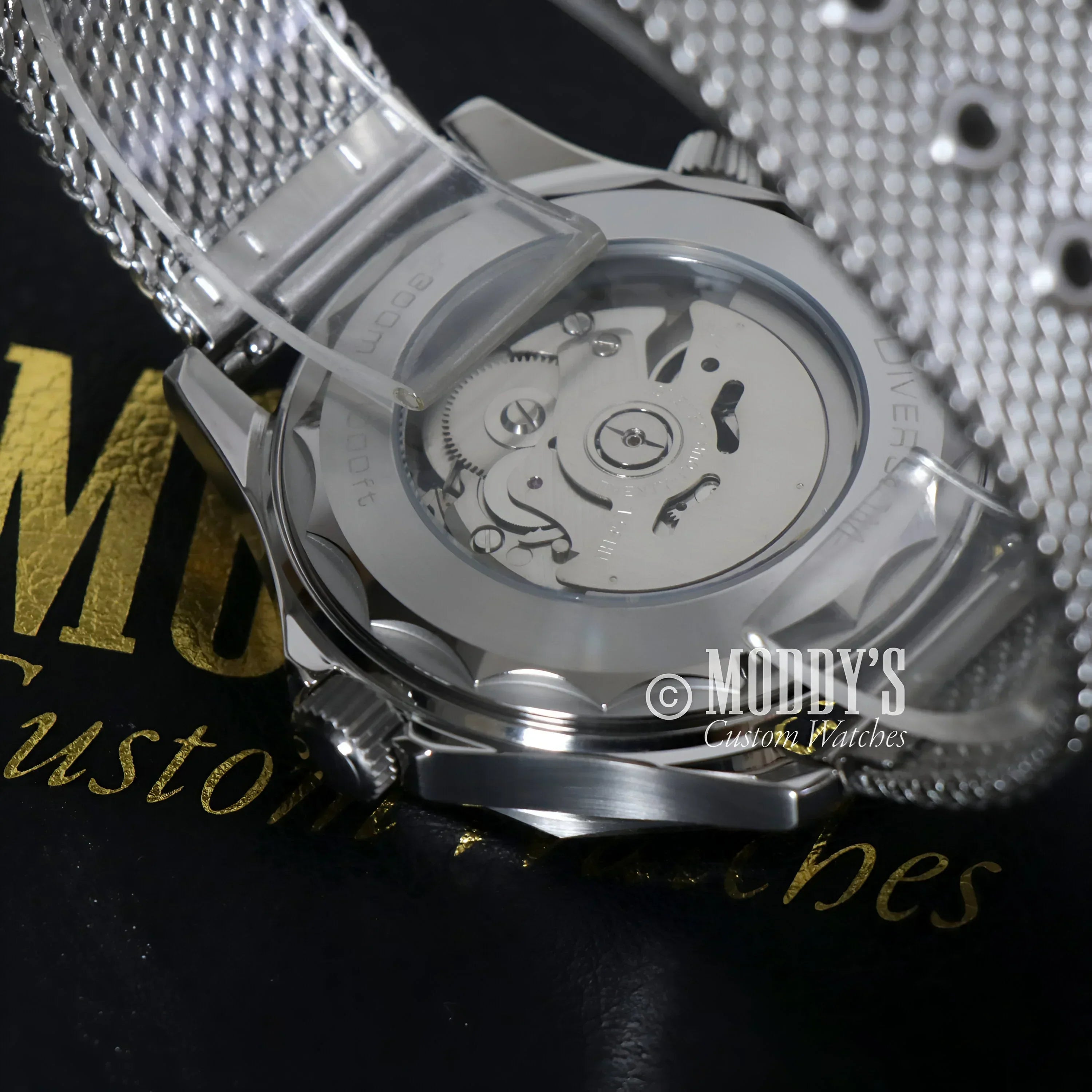 Silver Seikomaster James Bond 007 wristwatch with NH35 automatic movement visible
