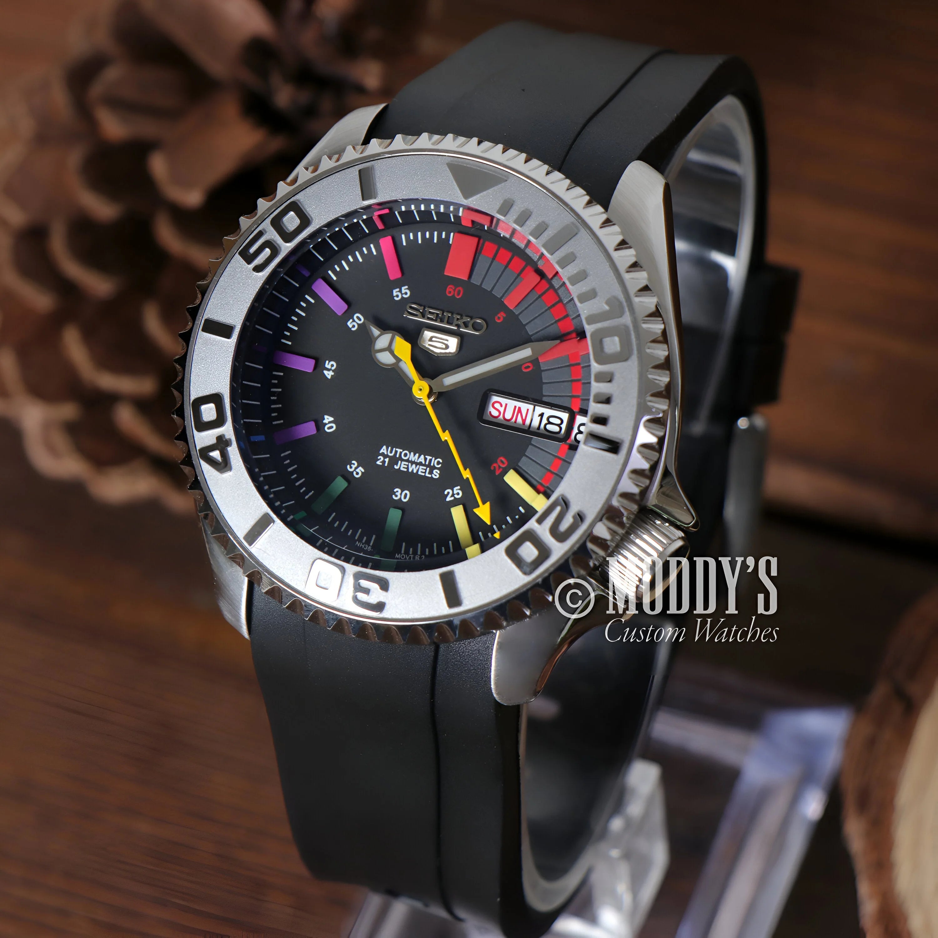 Stylish Seiko Mod SKX Rainbow diver’s watch with black dial and colorful markings