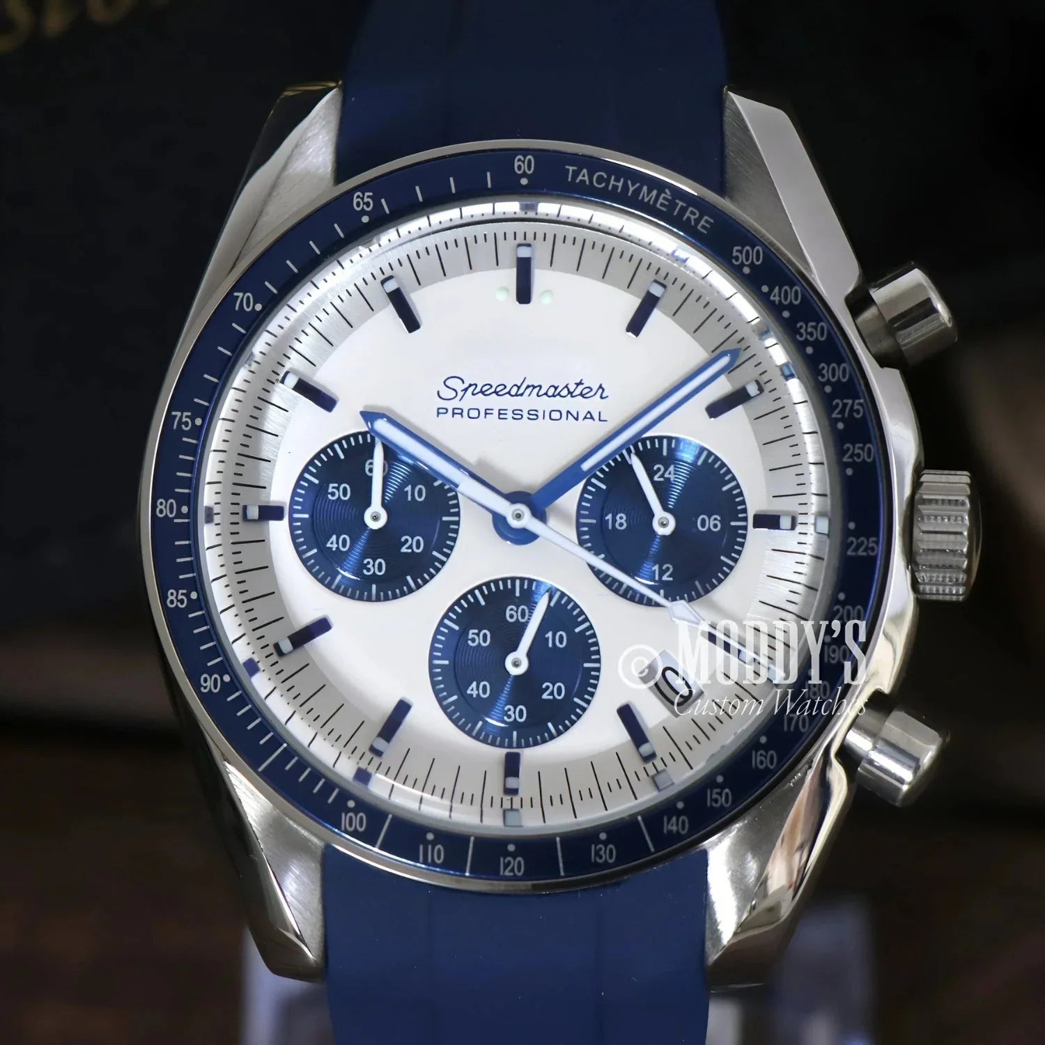 Silver and blue Speedmaster Professional watch from Speedseiko Snoopy Blue collection, featuring Seiko VK63 hybrid