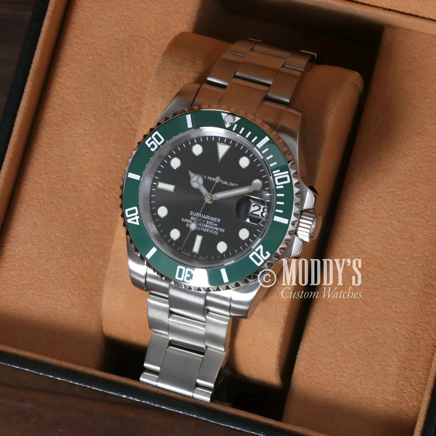 Silver wristwatch with green bezel from Seikomariner Kermit, featuring Seiko NH35 automatic