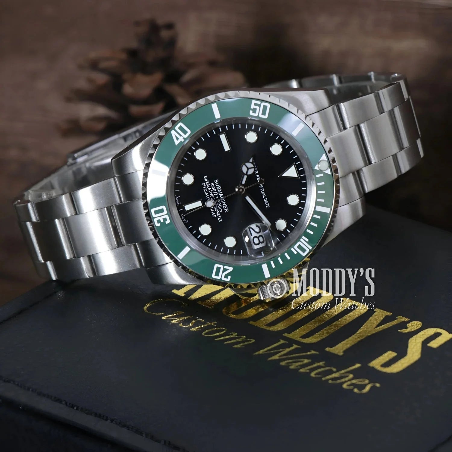 Silver Seiko mod wristwatch with green bezel, featuring Seiko NH35 automatic movement