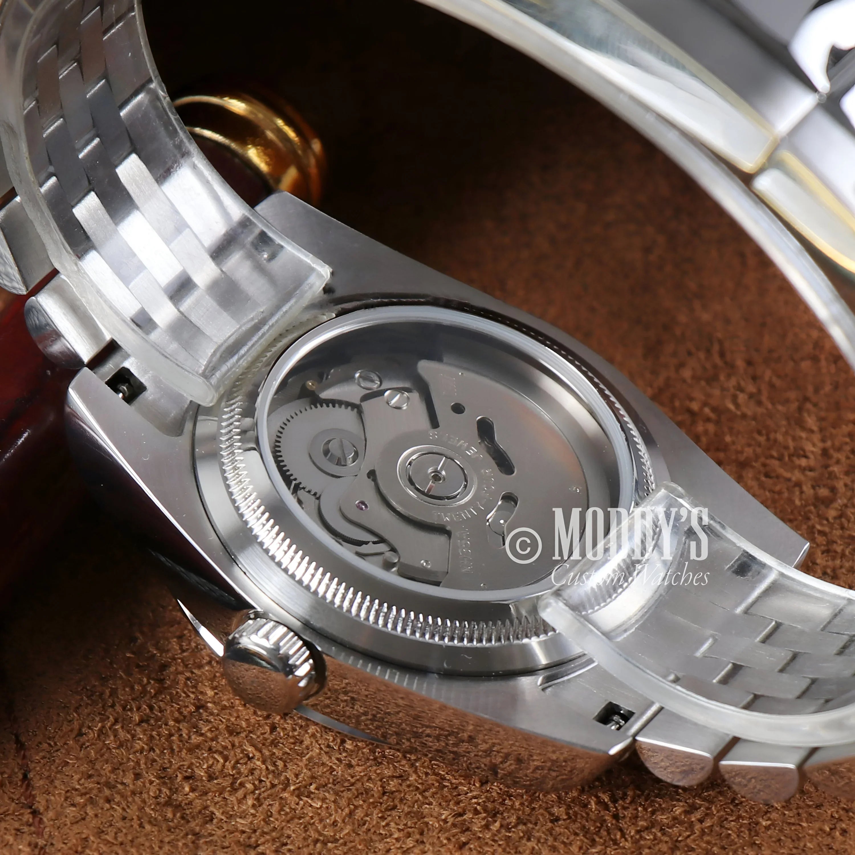 Close-up Seikojust Champagne Watch With Silver Dial On Brown Surface, Elegant Timepiece