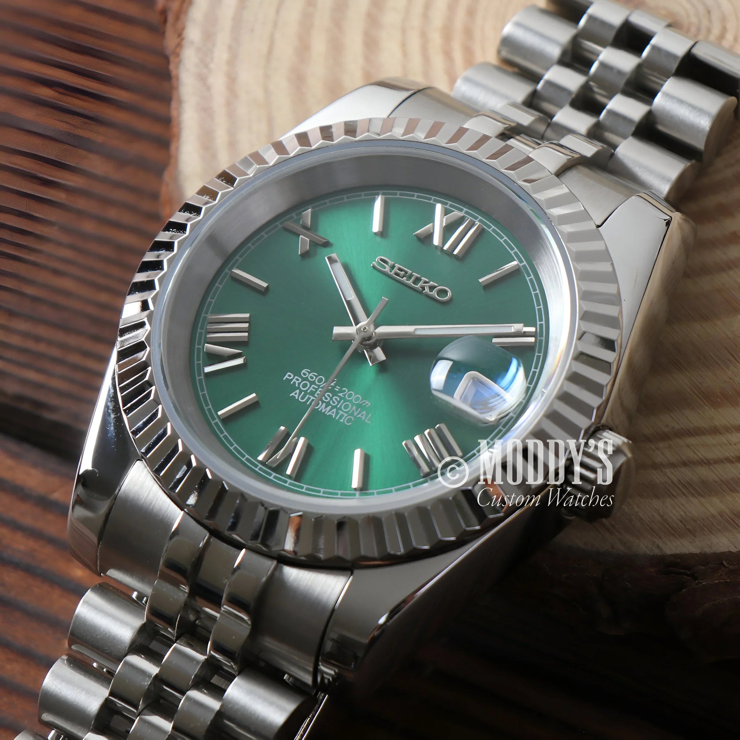 Close-up Of Seikojust Green Roman Watch With Green Dial On Wooden Surface, Automatic Nh35