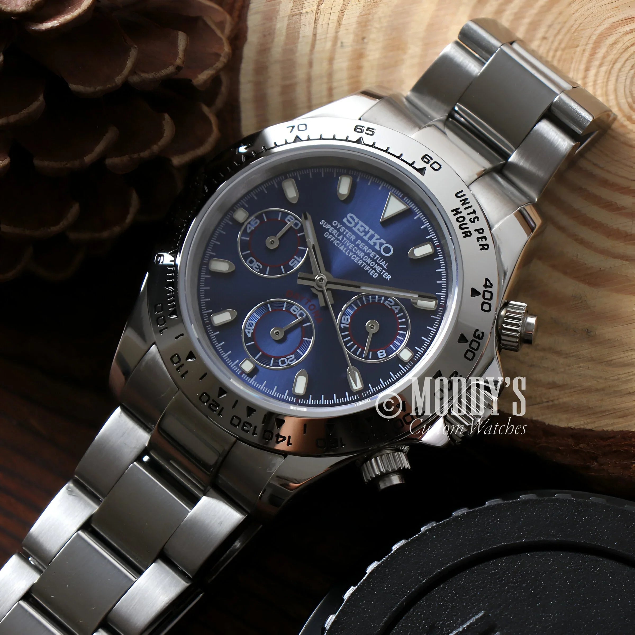 Seitona Silver - Blue Watch With Blue Dial On Wooden Table, Featuring Vk63 Hybrid Movement