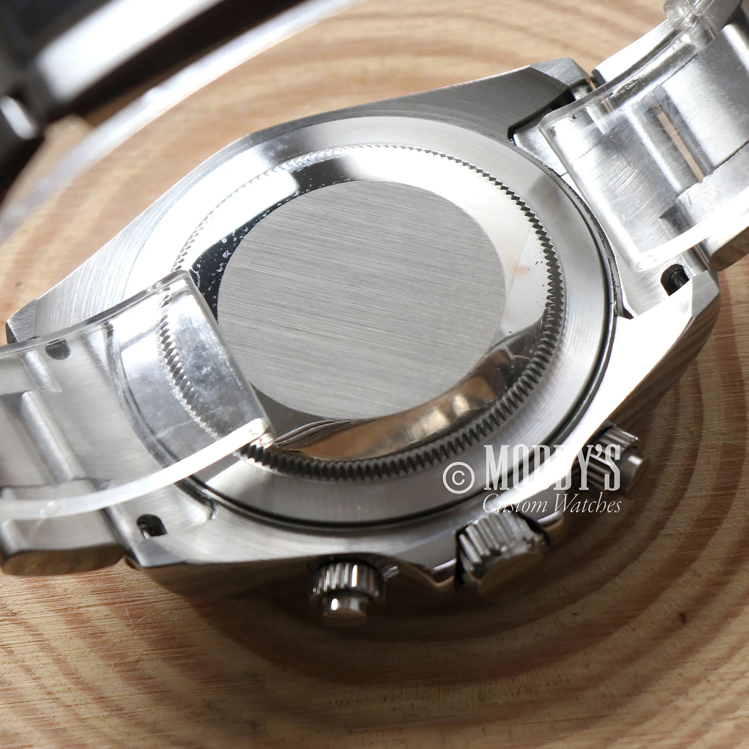 Seitona Silver - Blue Watch With Vk63 Hybrid Movement On a Sleek Wooden Table