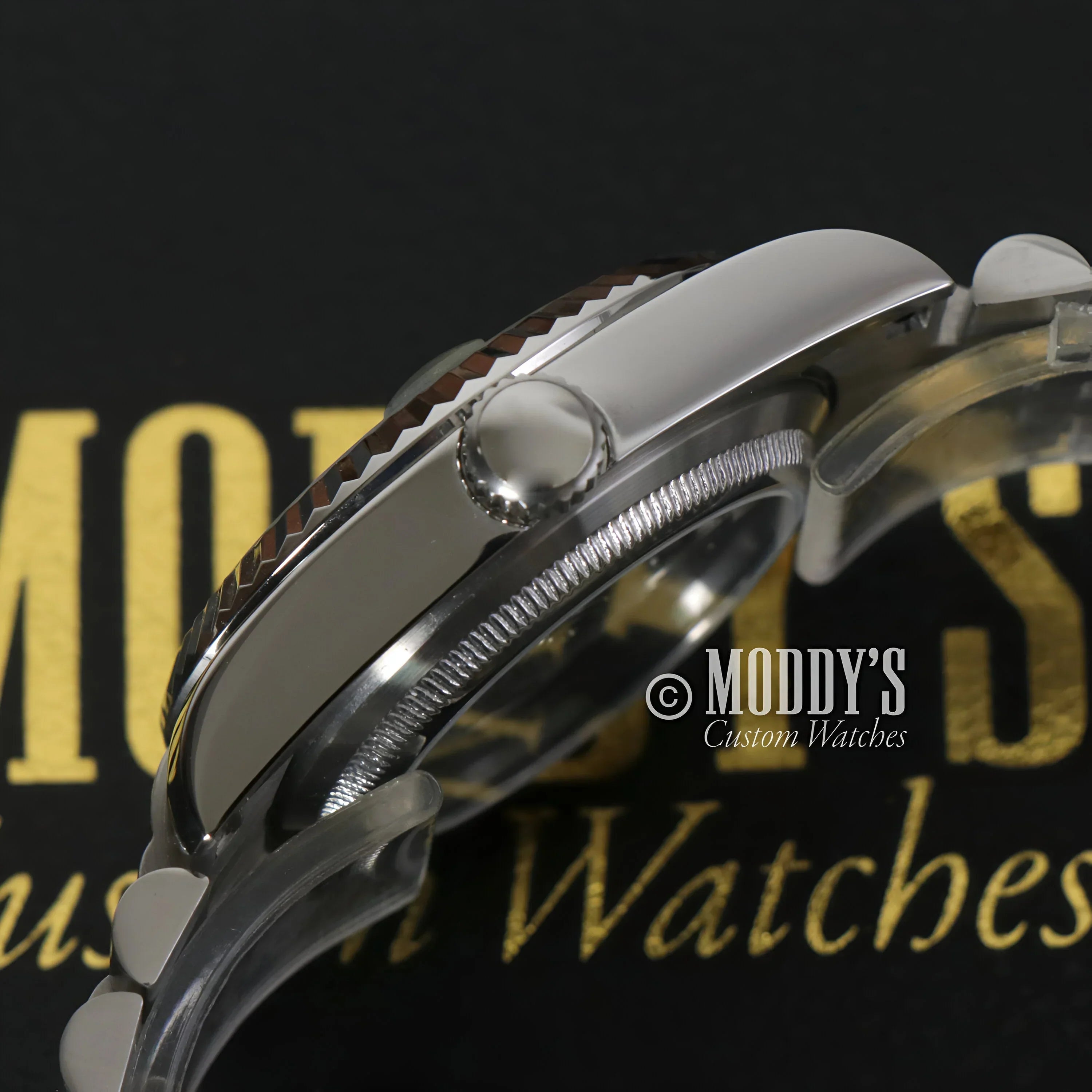 Silver wristwatch with textured bezel, featuring Seiko Mod Datejust and NH35 automatic movement