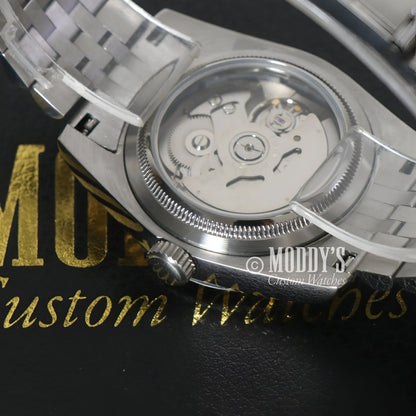 Silver Seikojust Royal Green Arabic wristwatch with NH35 automatic movement visible