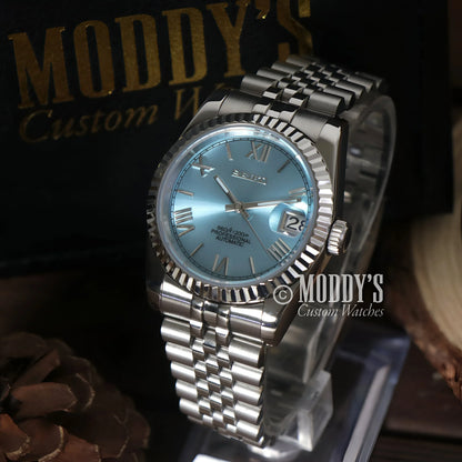Silver wristwatch with light blue face, featuring NH35 automatic movement, Ice Blue Roman design