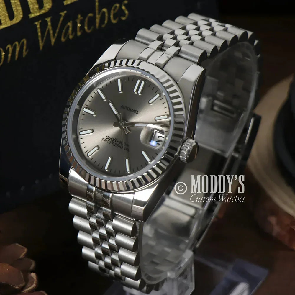 Silver wristwatch with fluted bezel from Seikojust Champagne, featuring Seiko NH35 automatic
