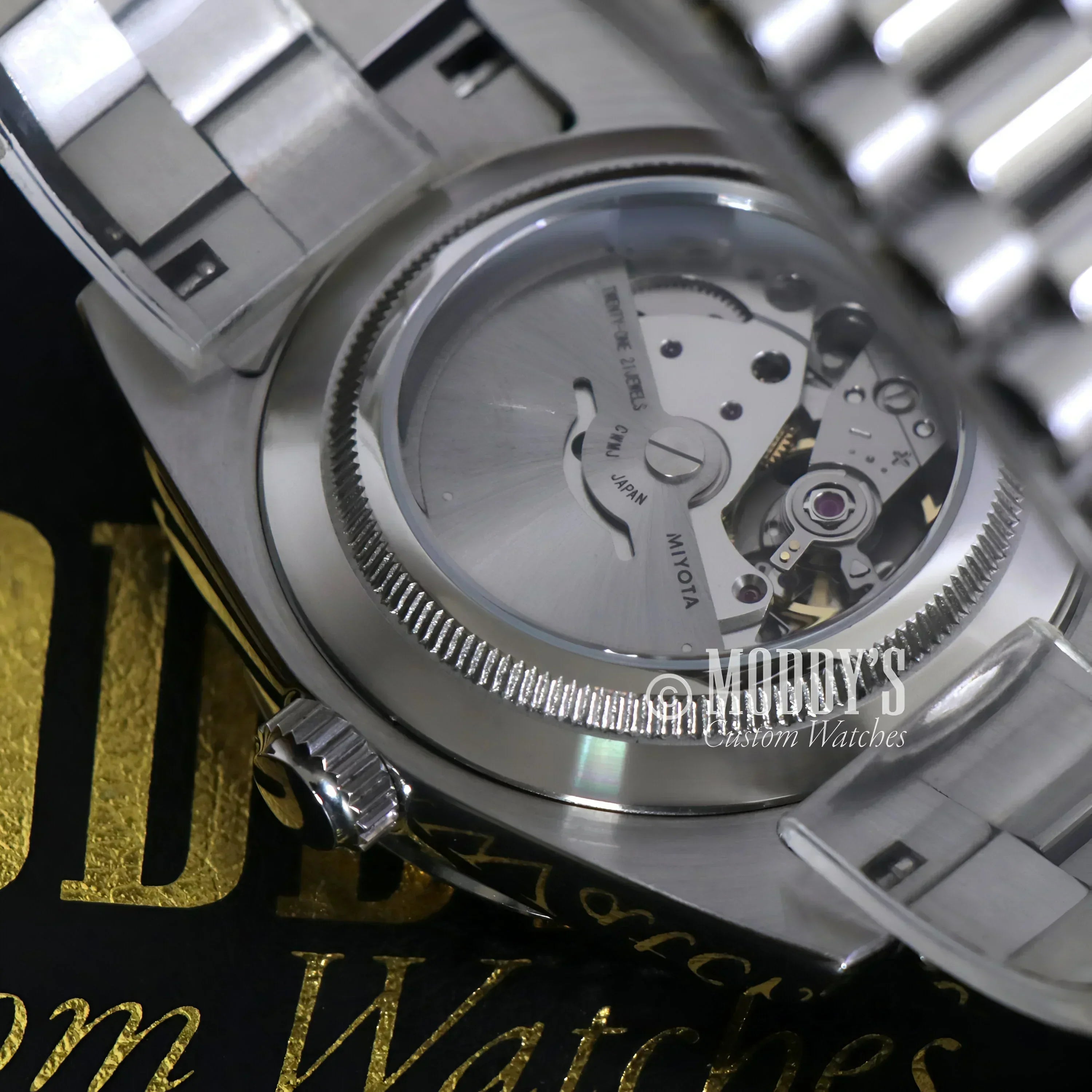 Silver wristwatch with exposed movement in Seikojust Daydate Classic Black, 904L stainless steel