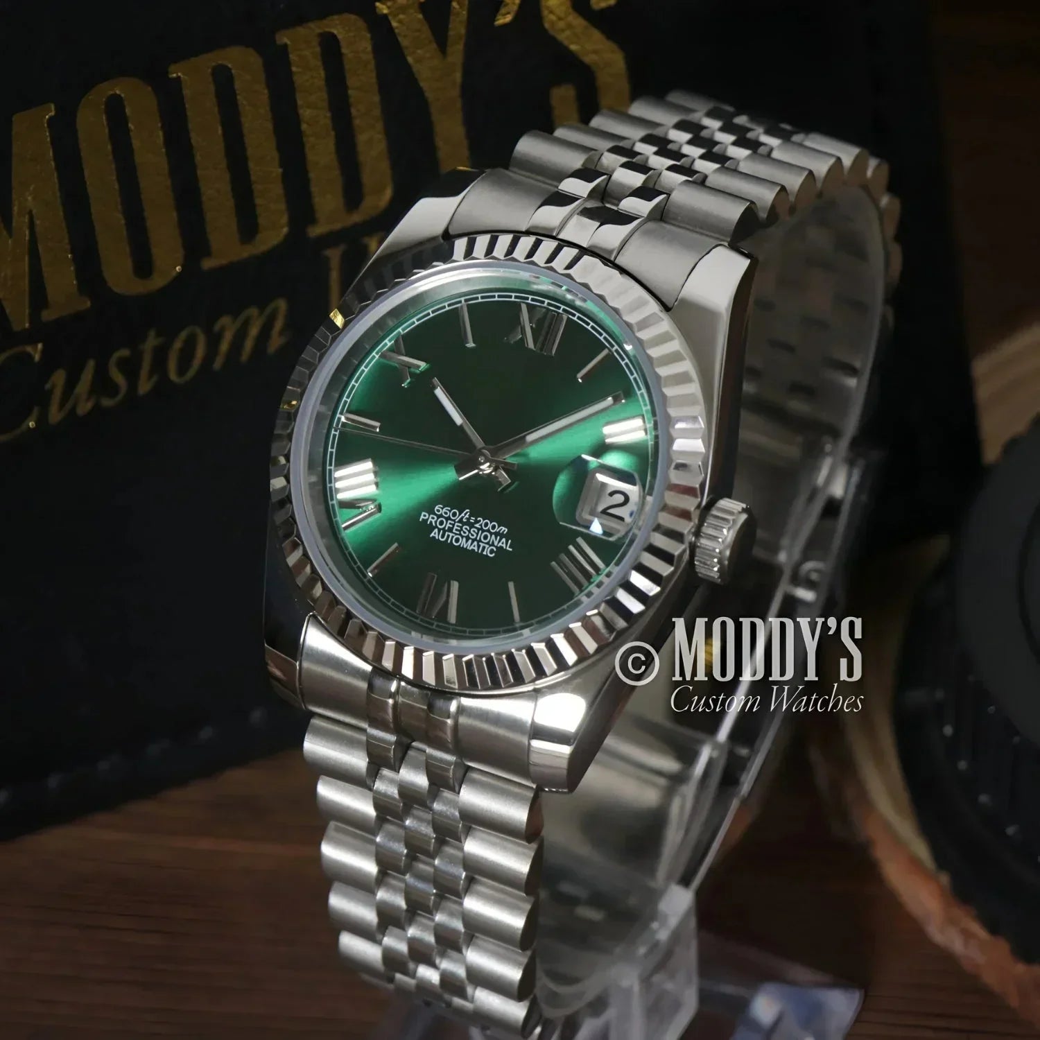 Silver Seikojust wristwatch with green face and NH35 automatic movement