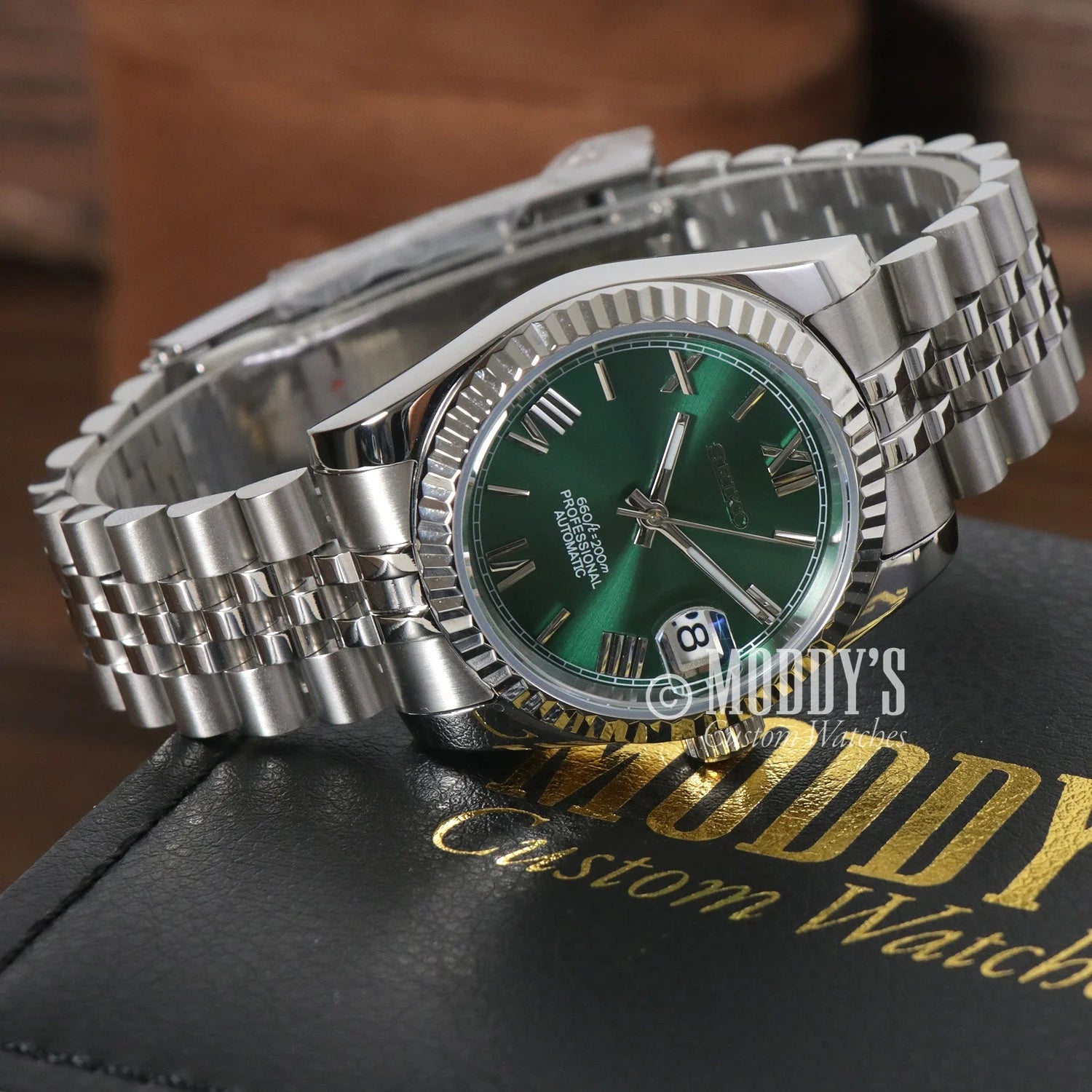 Rolex Datejust watch with green dial, Jubilee bracelet, and Seiko NH35 automatic movement