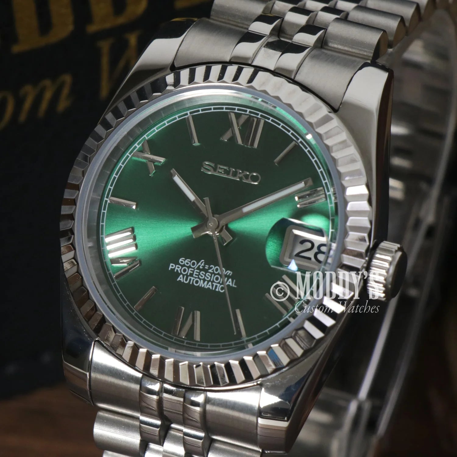 Seikojust Green Roman wristwatch with green dial, silver bracelet, and NH35 automatic movement