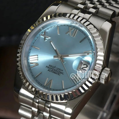Silver wristwatch with light blue face, Seiko Mod Datejust Ice Blue Roman, NH35 automatic movement