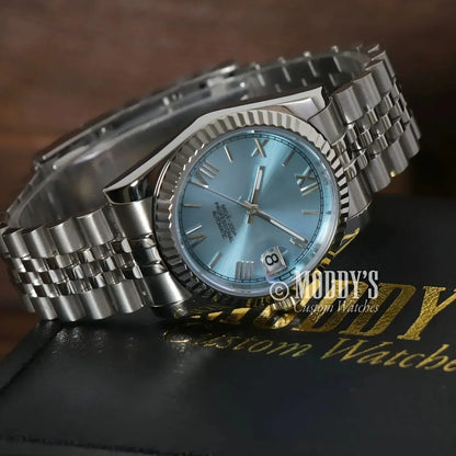 Silver wristwatch with light blue face, featuring NH35 automatic movement, Ice Blue Roman style